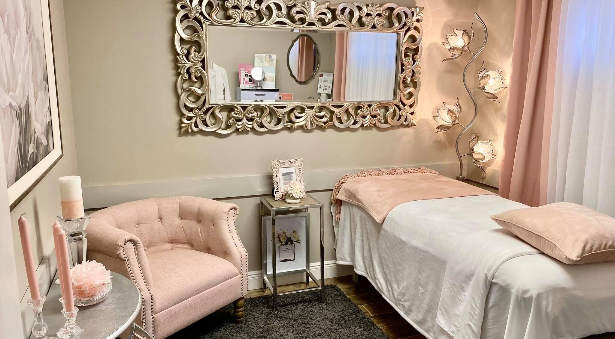 Elegant spa room at Spa by MD in Lakeland, Florida, US with a plush chair and decorative mirror.