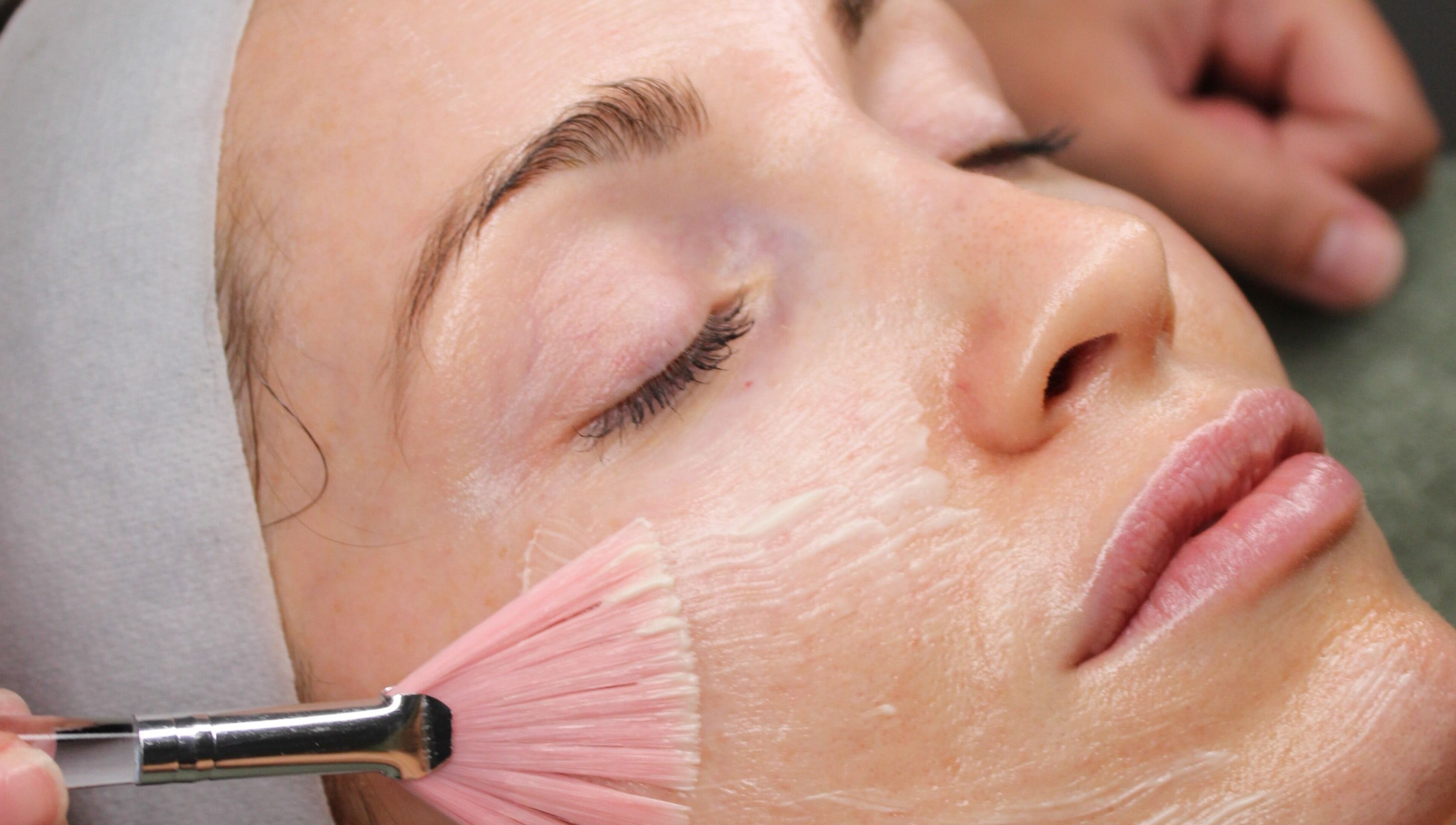 Woman receiving luxury facial treatment at Sattva Aesthetics, Caringbah, New South Wales, AU.
