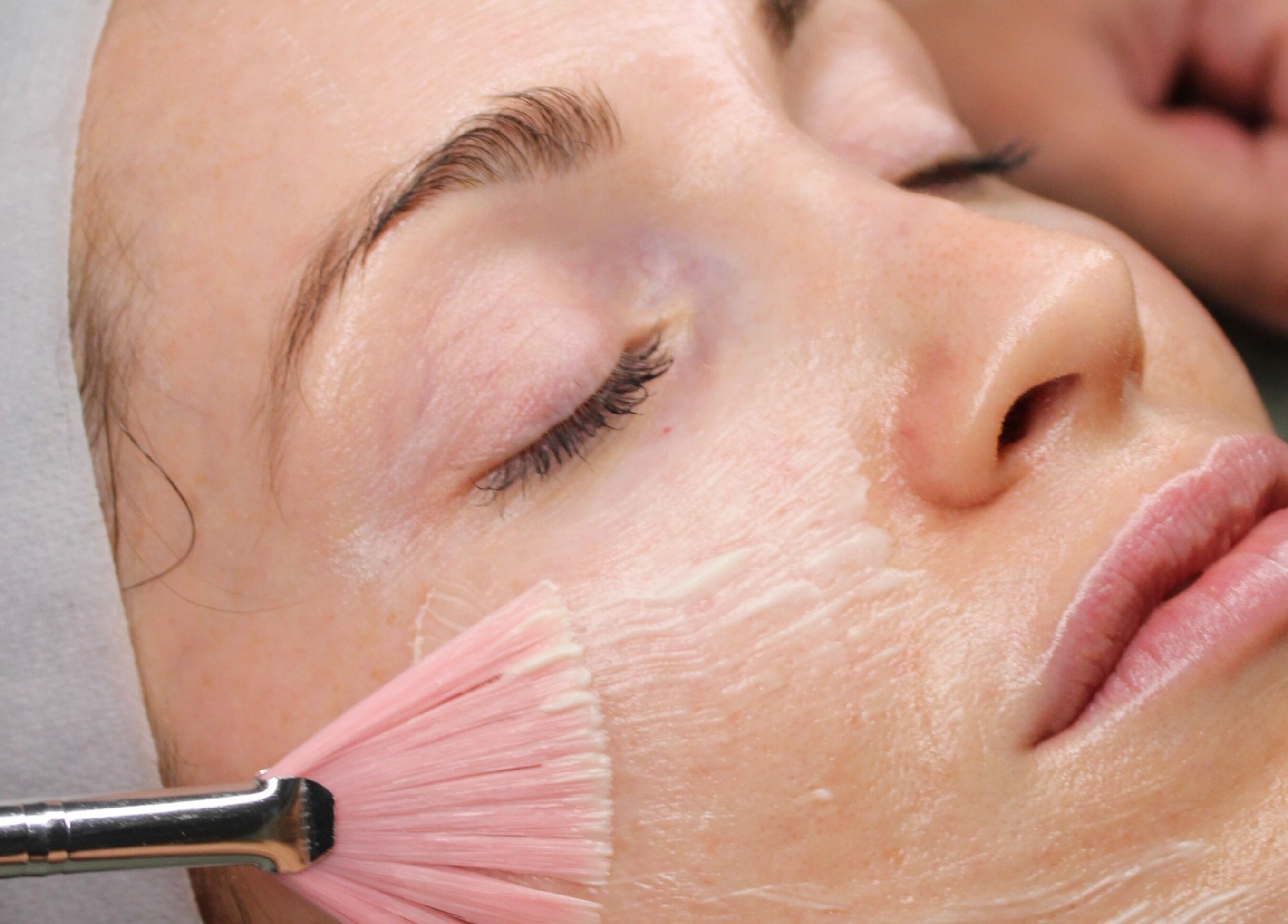 Woman receiving luxury facial treatment at Sattva Aesthetics, Caringbah, New South Wales, AU.