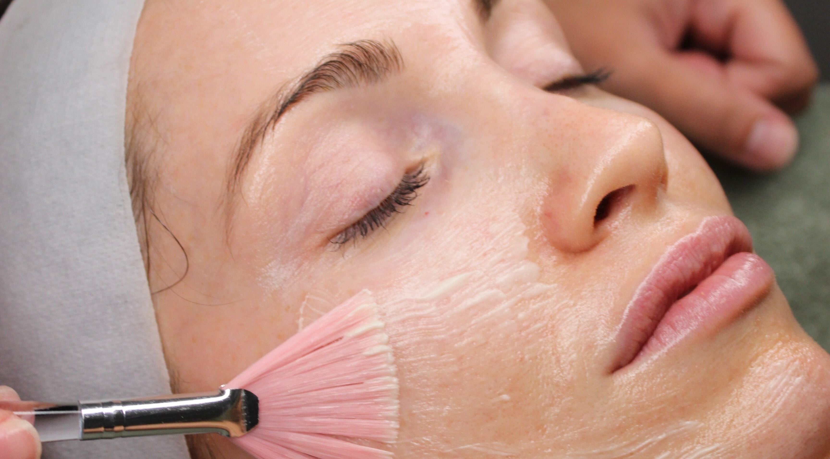Woman receiving luxury facial treatment at Sattva Aesthetics, Caringbah, New South Wales, AU.
