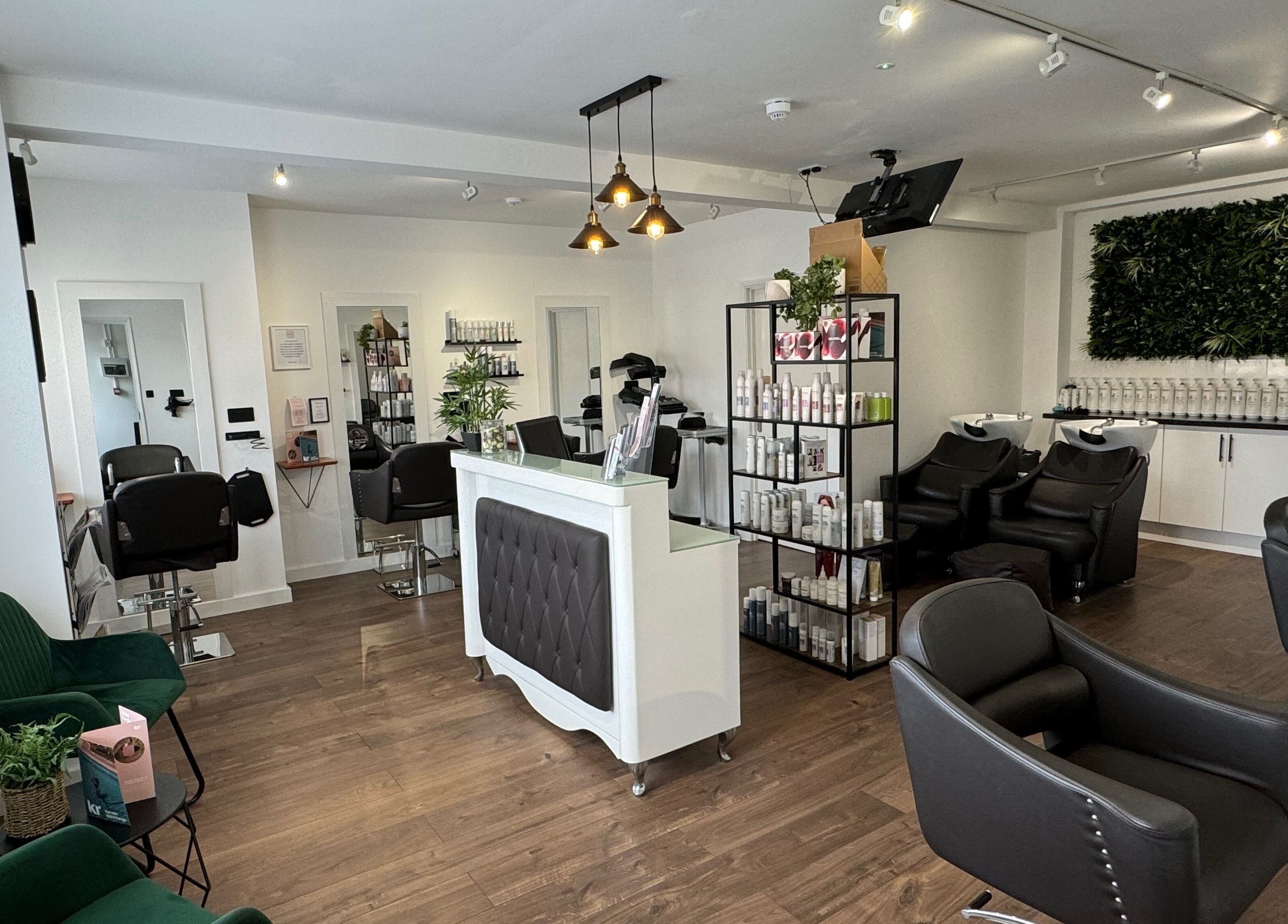 Interior of New You Hair Salon in Clacton-on-Sea, GB, featuring modern chairs, sleek decor, and a welcoming ambiance.