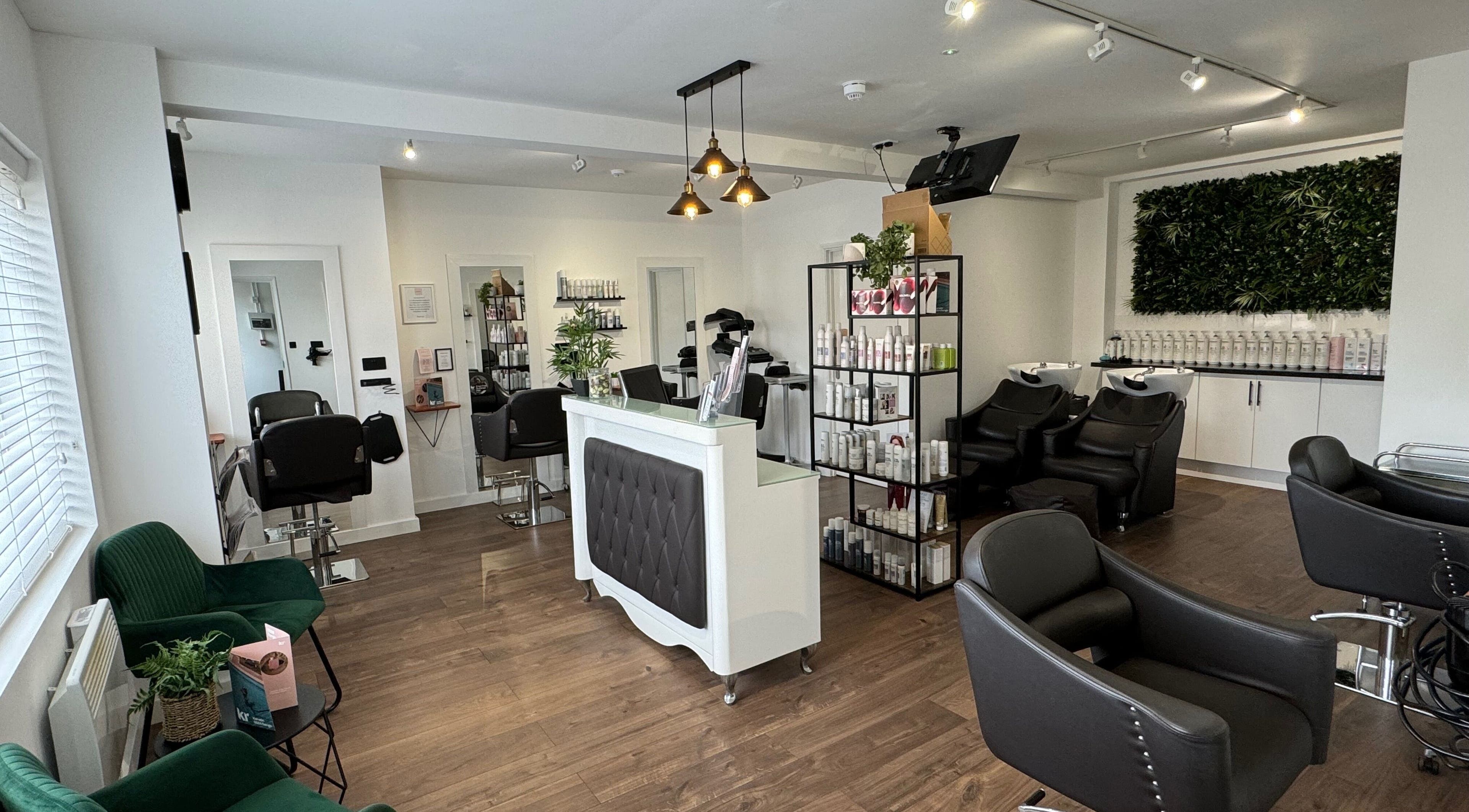 Interior of New You Hair Salon in Clacton-on-Sea, GB, featuring modern chairs, sleek decor, and a welcoming ambiance.