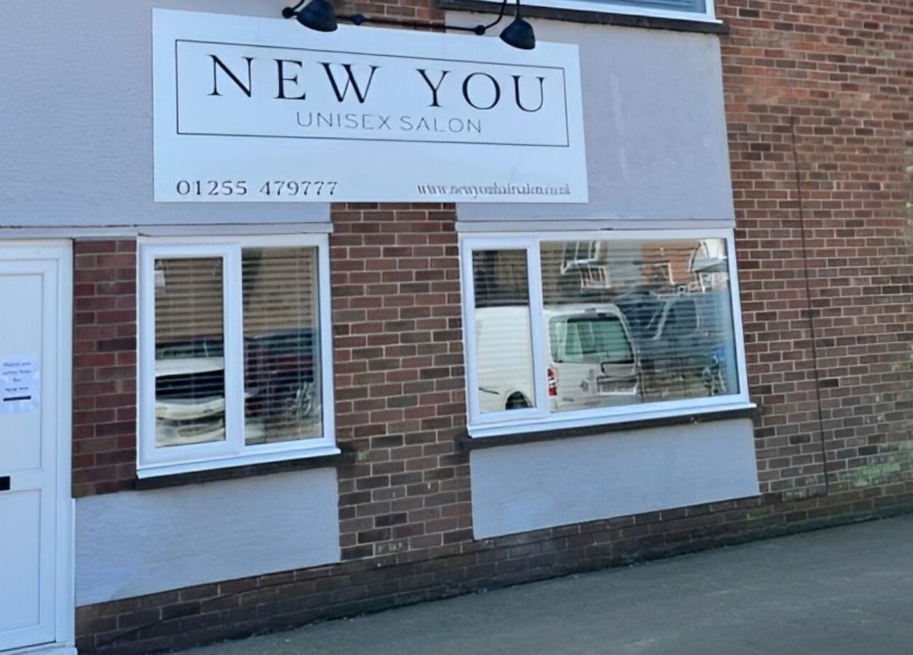 Front view of New You Hair Salon in Clacton-on-Sea, GB, showcasing modern signage and window display.
