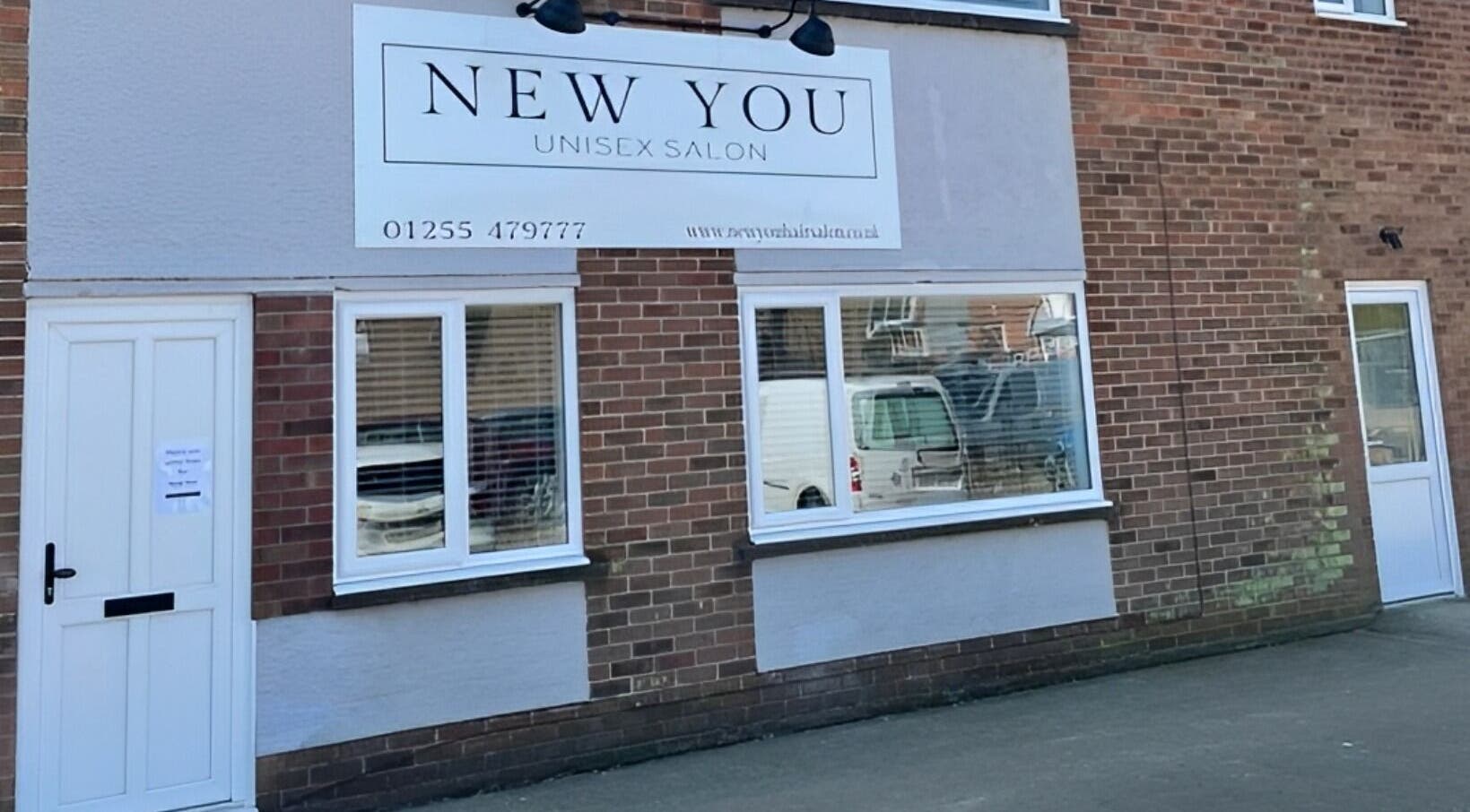 Front view of New You Hair Salon in Clacton-on-Sea, GB, showcasing modern signage and window display.
