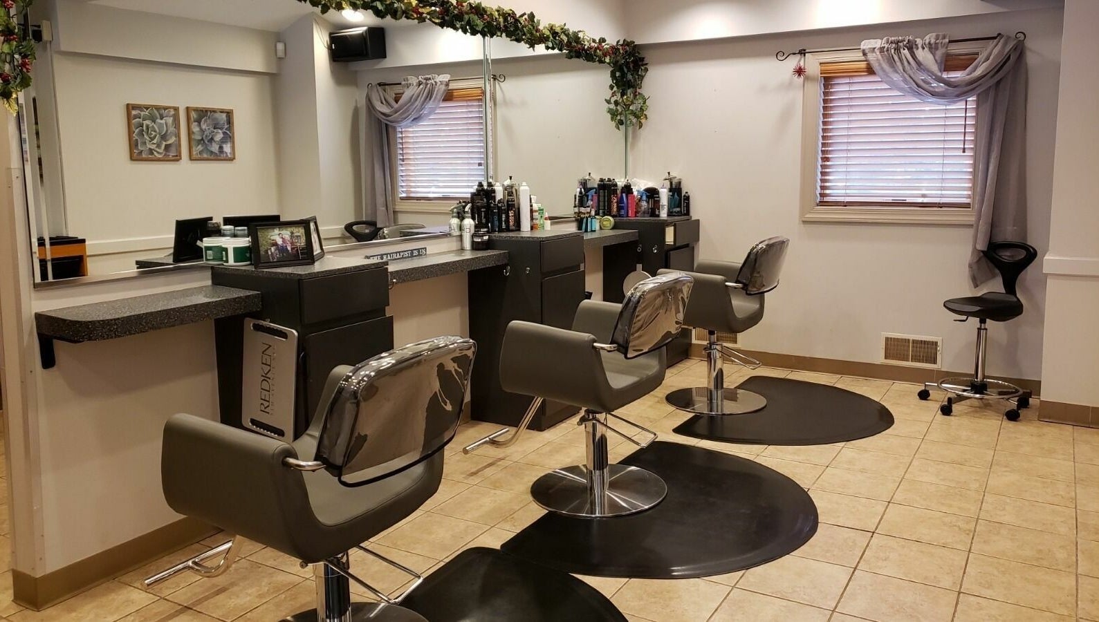 Modern salon chairs at Raymond Salon N Spa, Franklin Township, New Jersey, US, showcasing a stylish interior.