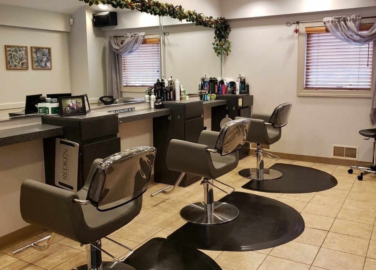 Modern salon chairs at Raymond Salon N Spa, Franklin Township, New Jersey, US, showcasing a stylish interior.