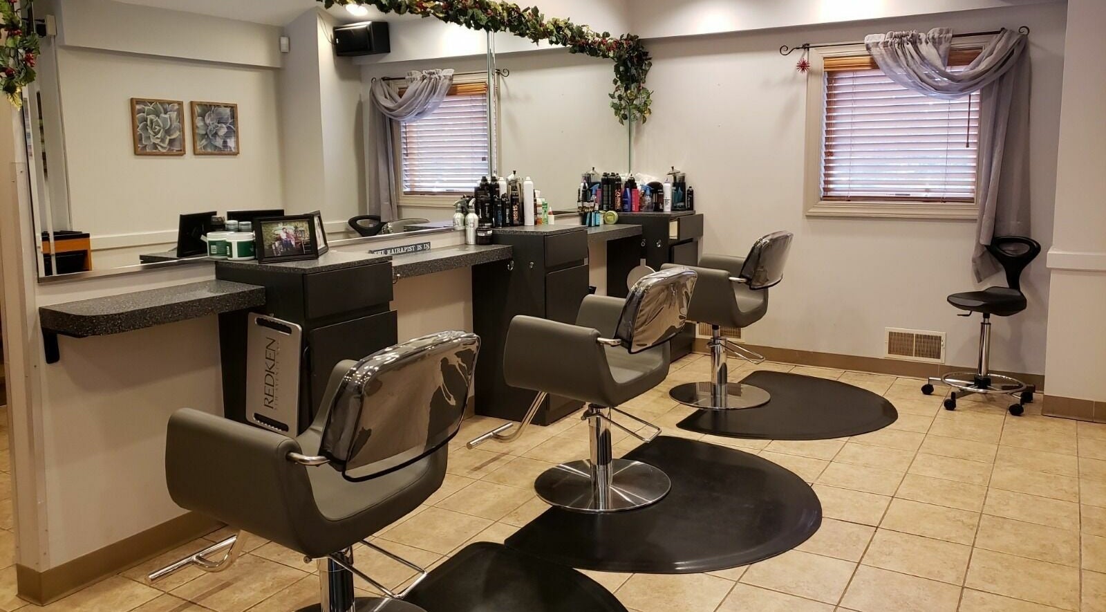 Modern salon chairs at Raymond Salon N Spa, Franklin Township, New Jersey, US, showcasing a stylish interior.