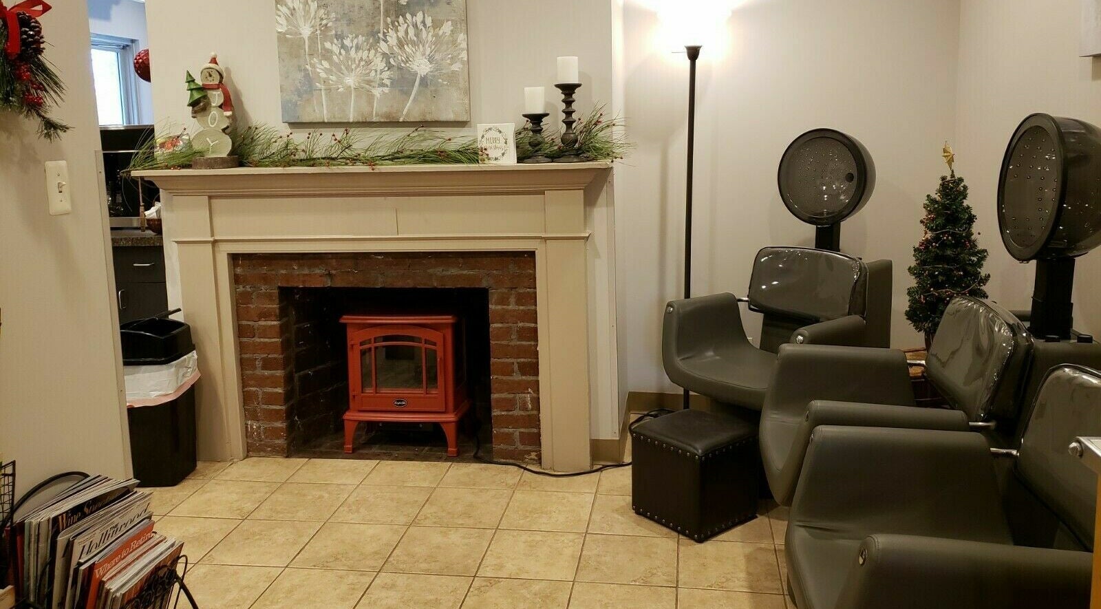 Relaxing seating area at Raymond Salon N Spa, Franklin Township, New Jersey, US, with fireplace and decor.
