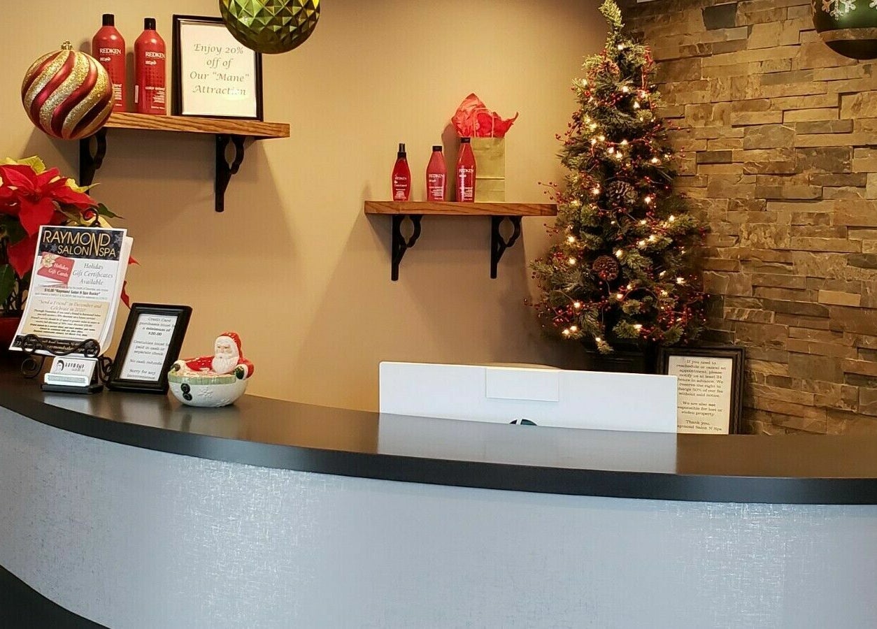 Festive reception at Raymond Salon N Spa, Franklin Township, New Jersey, with holiday decor and products.