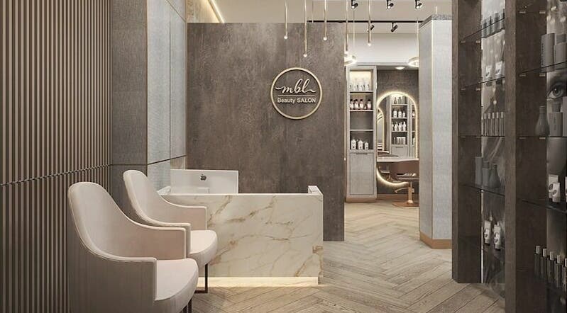 Elegant interior of M B L Beauty Lounge in Dubai, Dubai, AE featuring luxurious chairs and product shelves.