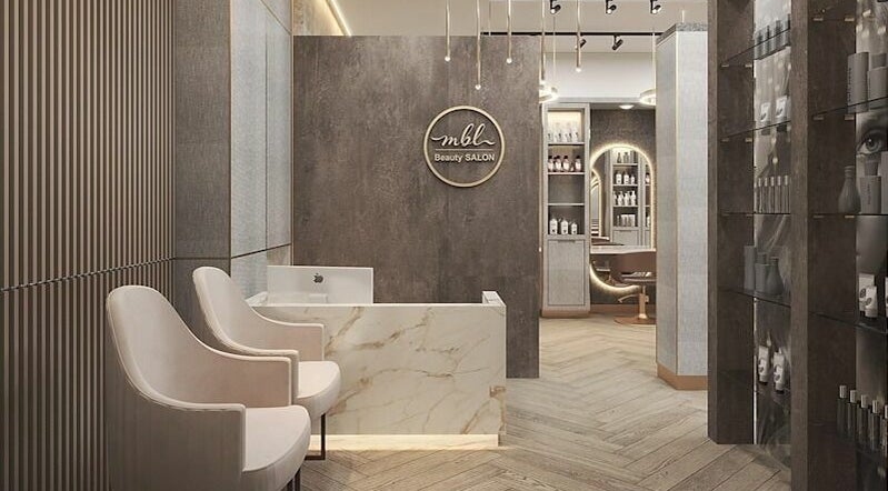 Elegant interior of M B L Beauty Lounge in Dubai, Dubai, AE featuring luxurious chairs and product shelves.