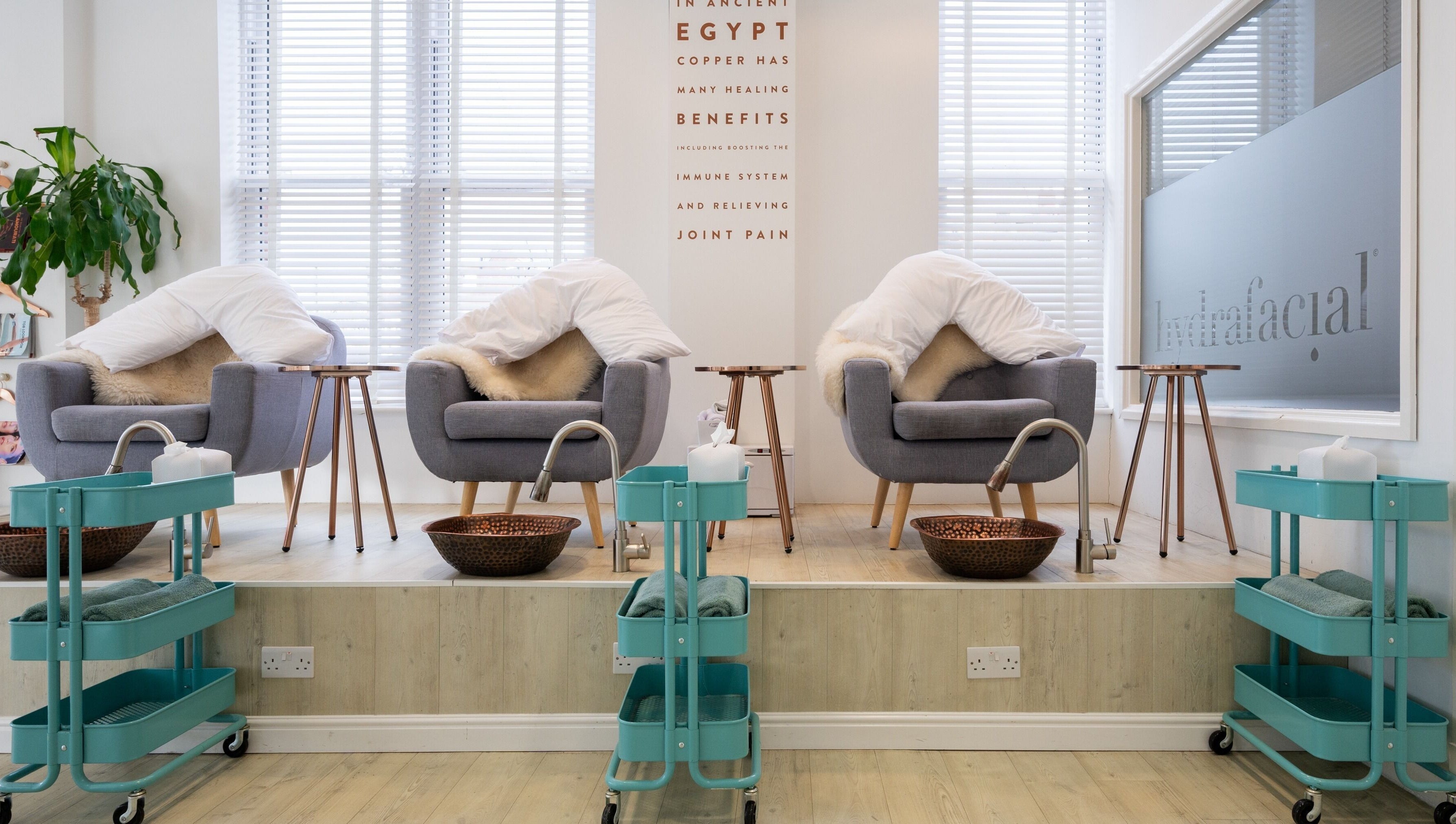 Cozy spa chairs with fur blankets at Preen, Stockport, England, GB for a relaxing wellness experience.