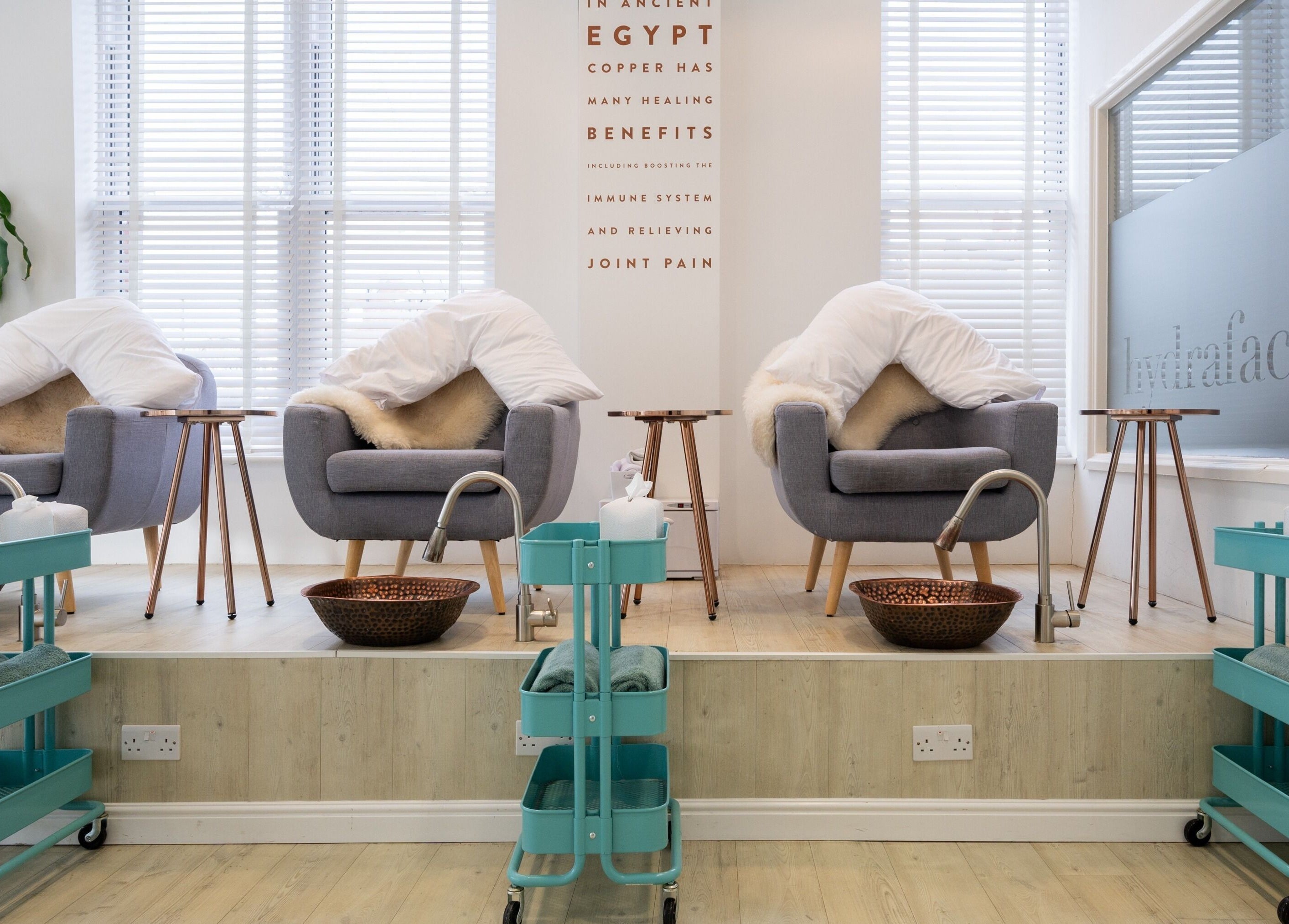 Cozy spa chairs with fur blankets at Preen, Stockport, England, GB for a relaxing wellness experience.