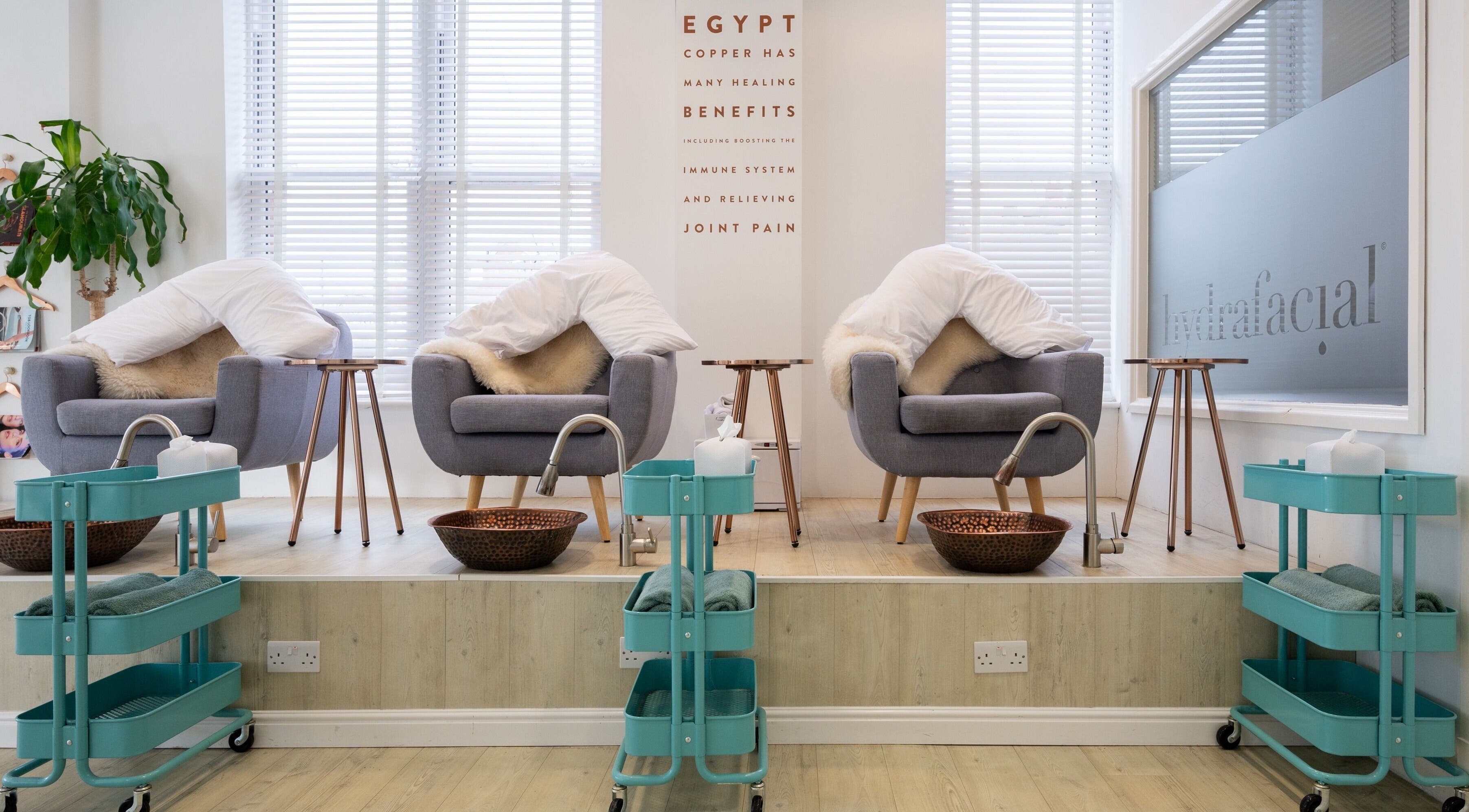 Cozy spa chairs with fur blankets at Preen, Stockport, England, GB for a relaxing wellness experience.