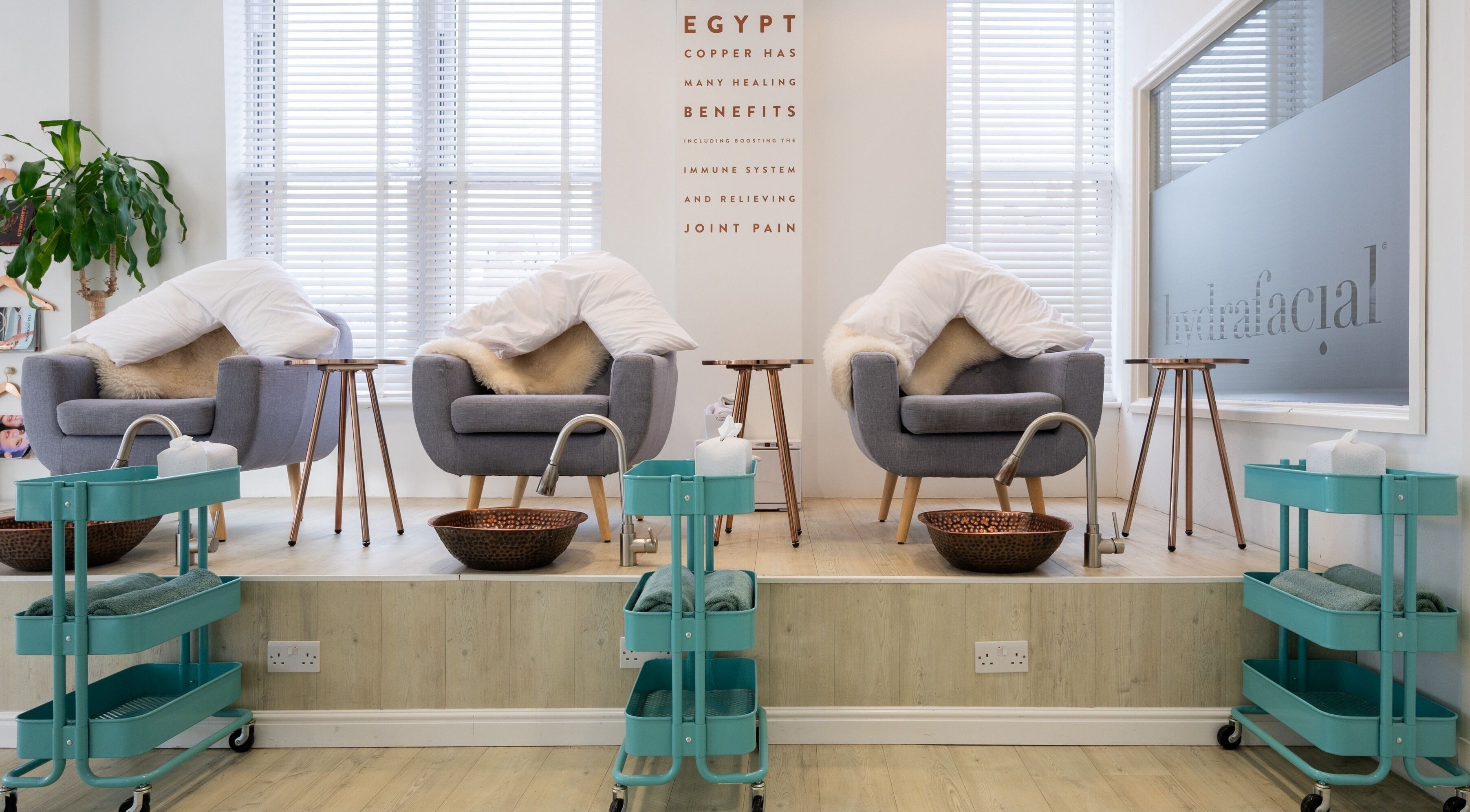 Cozy spa chairs with fur blankets at Preen, Stockport, England, GB for a relaxing wellness experience.
