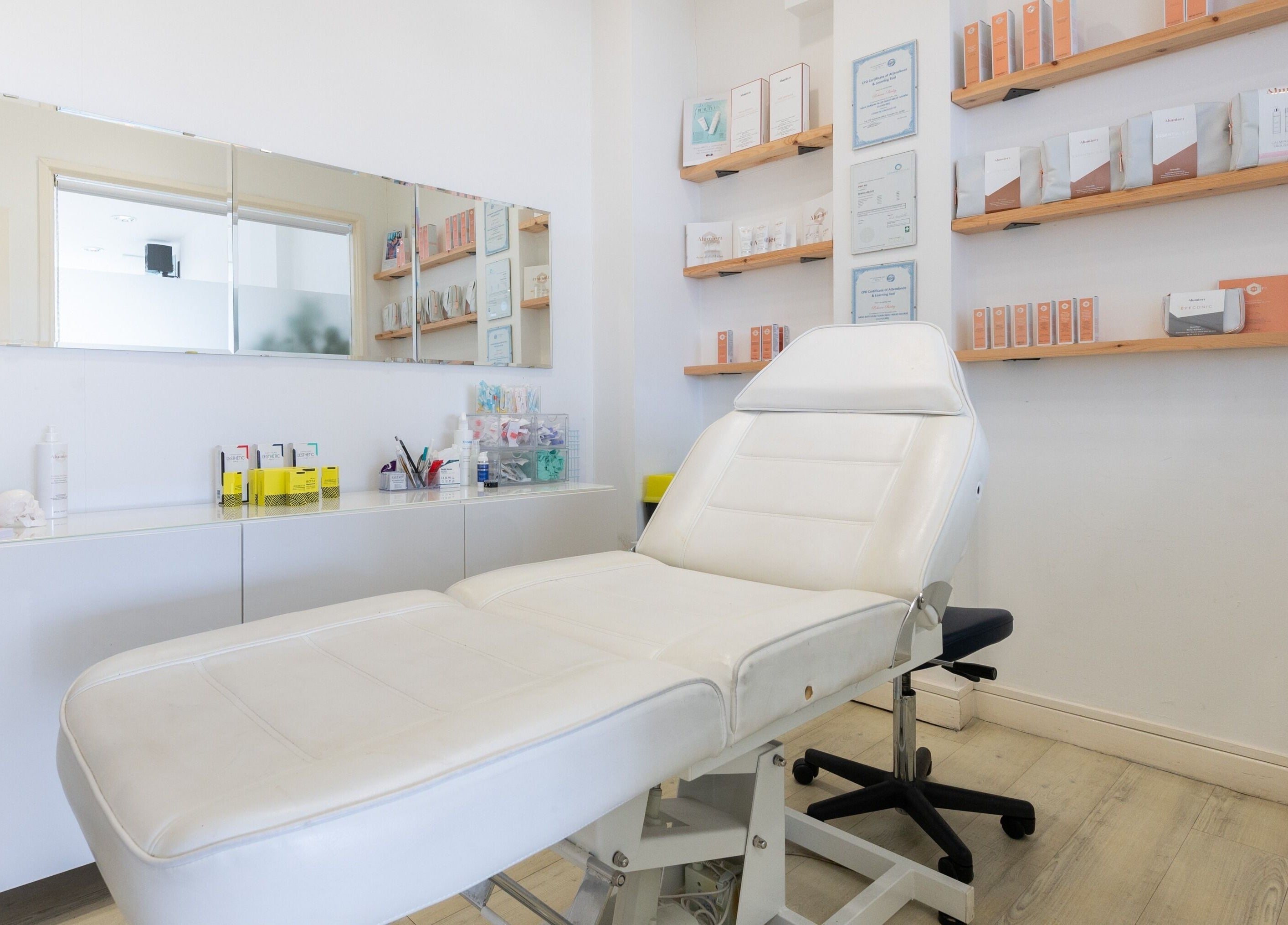 Elegant treatment room at Preen, Stockport, England, GB, featuring a plush white massage table.