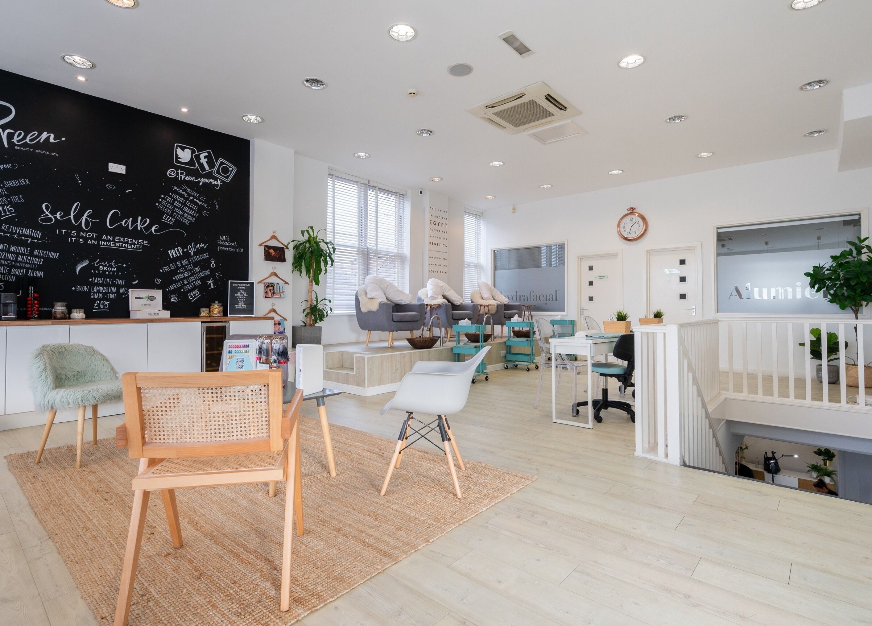 Modern, cozy interior of Preen salon, Stockport, England, GB with stylish chairs and decor.