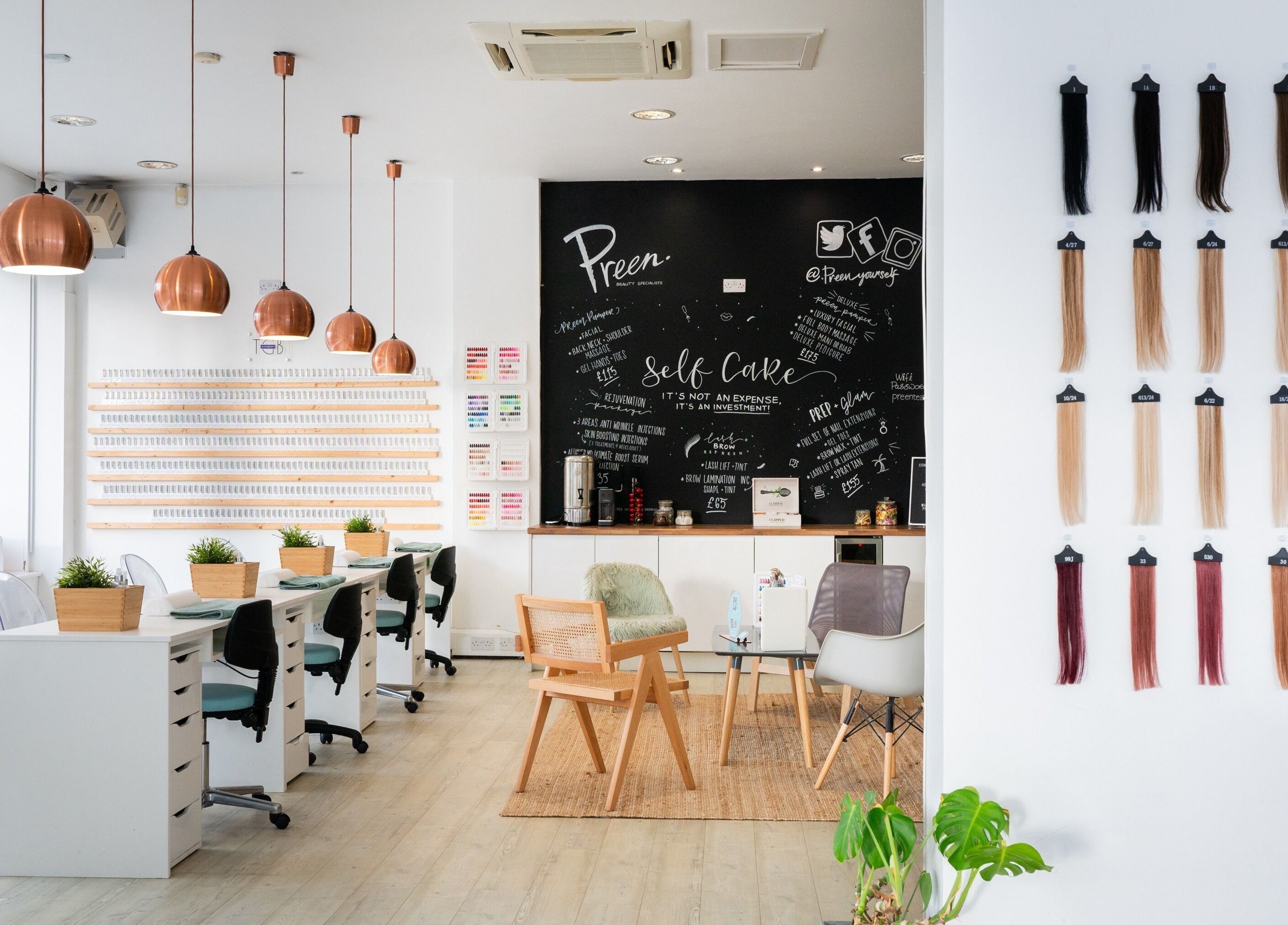 Modern interior of Preen in Stockport, England, showcases stylish salon chairs and hair color samples displayed.