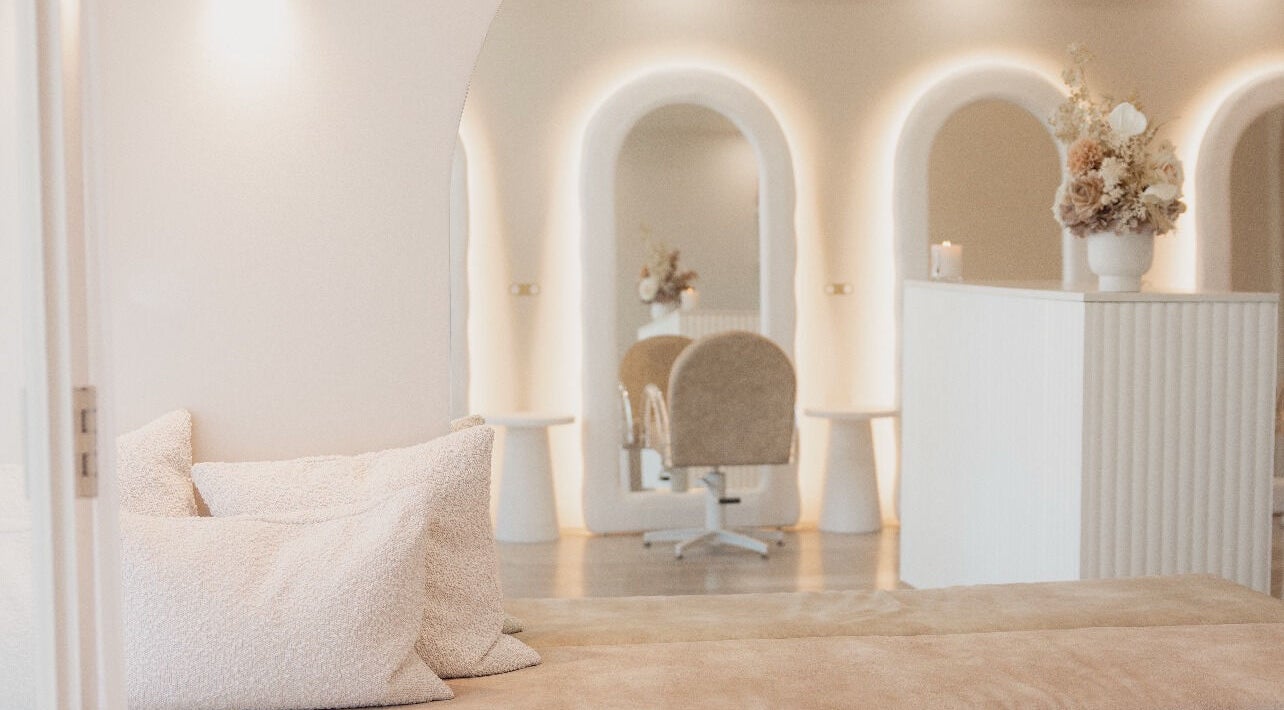 Elegant JC Body Boutique interior with soft lighting and plush decor in Melbourne, Victoria, AU.