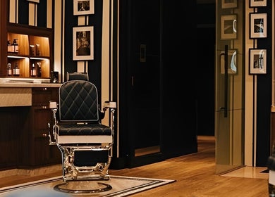 Luxurious interior of Barberia Italiana Grooming Lounge Ltd. in Dubai, Dubai, AE with leather barber chair.