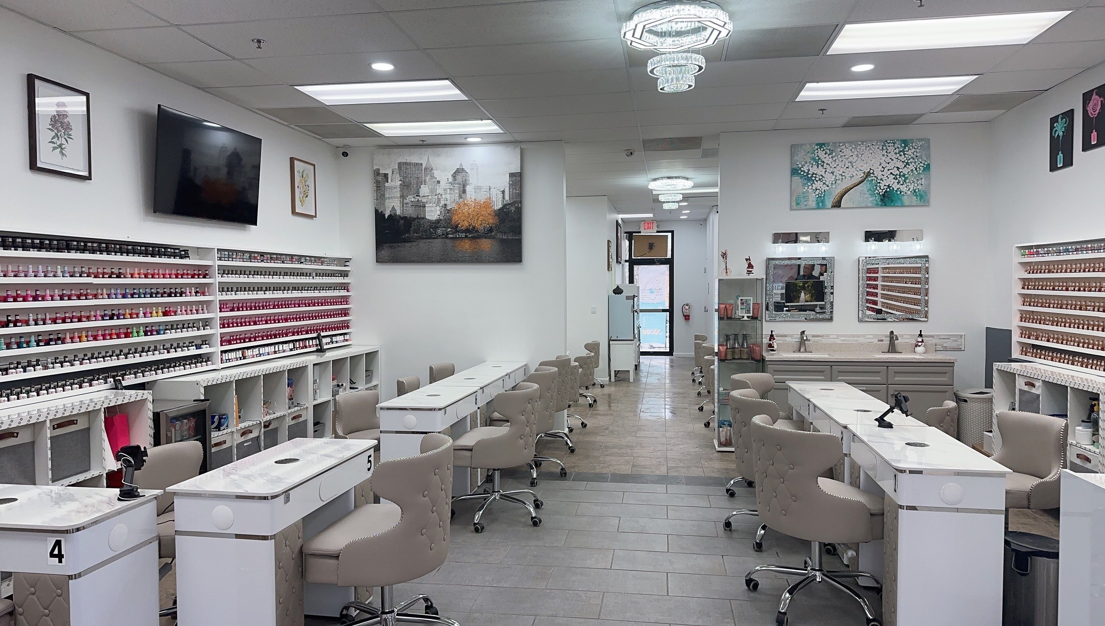 Modern nail salon interior at Nail Studio, Tega Cay, South Carolina, US featuring elegant seating and polish displays.