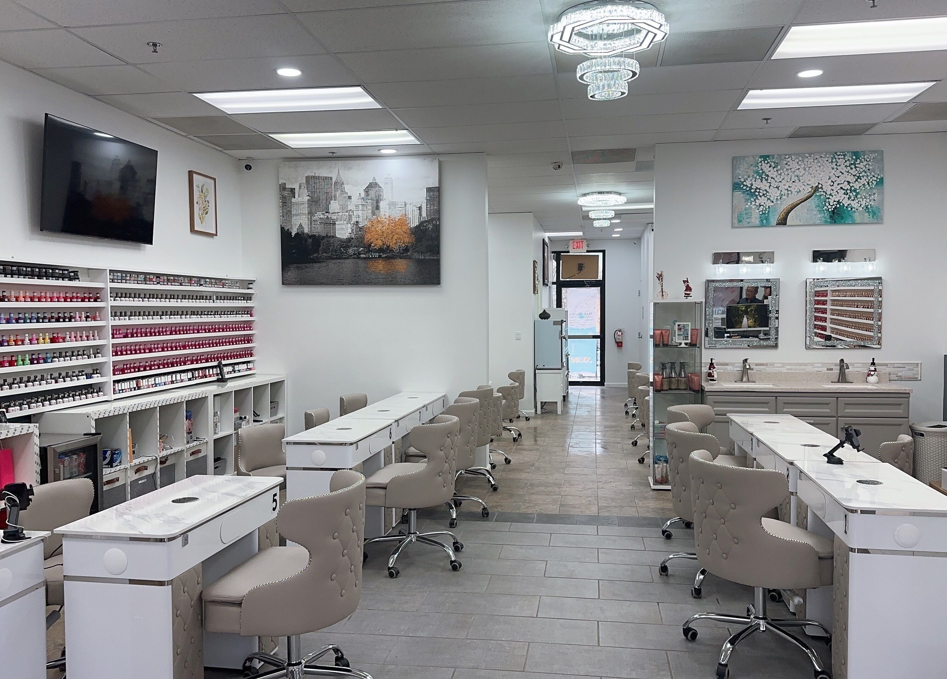 Modern nail salon interior at Nail Studio, Tega Cay, South Carolina, US featuring elegant seating and polish displays.