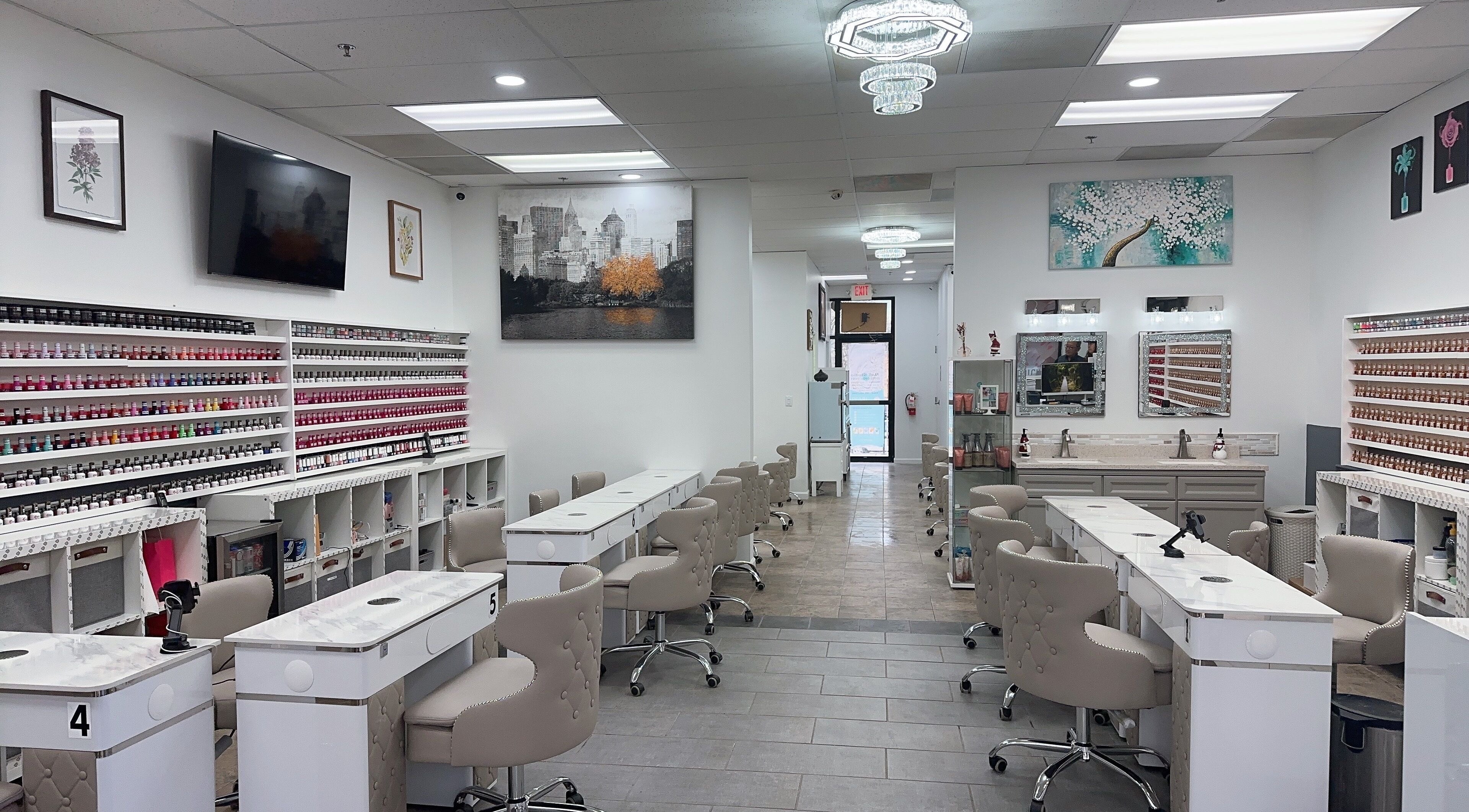 Modern nail salon interior at Nail Studio, Tega Cay, South Carolina, US featuring elegant seating and polish displays.