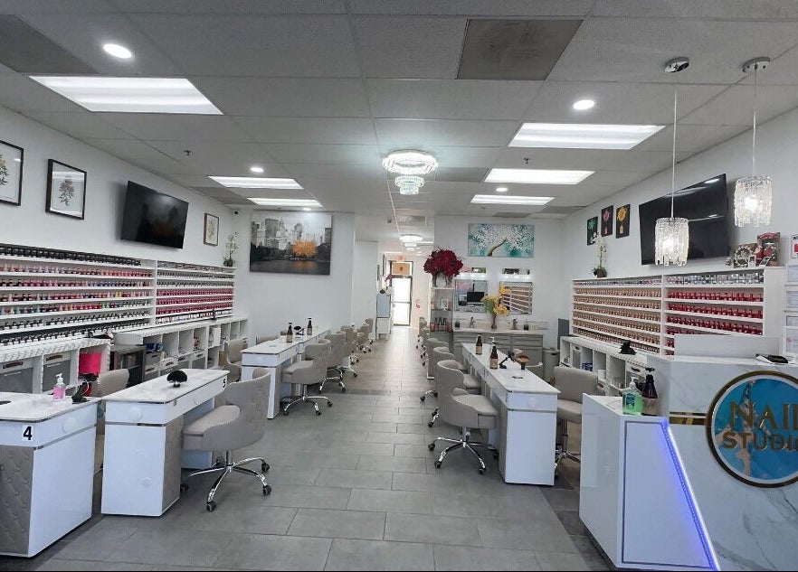 Elegant interior of Nail Studio in Tega Cay, South Carolina, US featuring modern nail stations.