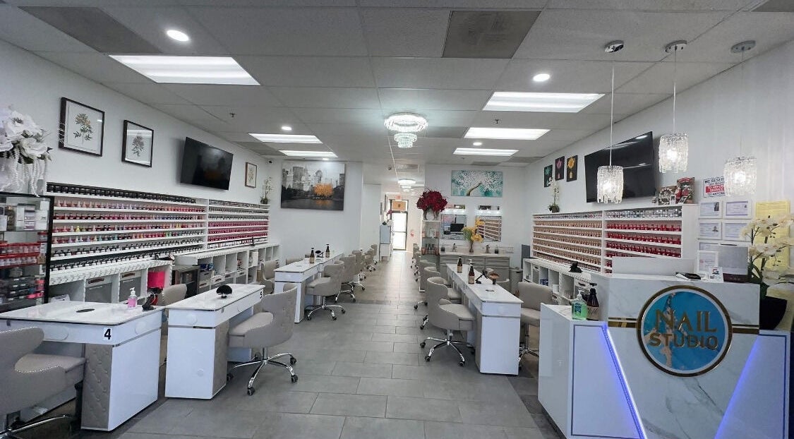 Elegant interior of Nail Studio in Tega Cay, South Carolina, US featuring modern nail stations.