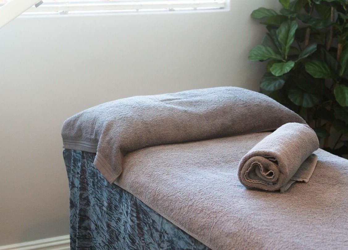 Relaxing massage bed at Gingerlily Spa, Cape Town, Western Cape, ZA, ready for a soothing treatment.