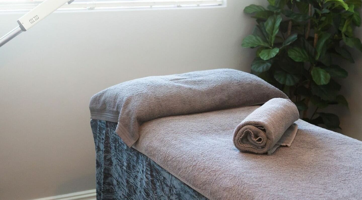 Relaxing massage bed at Gingerlily Spa, Cape Town, Western Cape, ZA, ready for a soothing treatment.