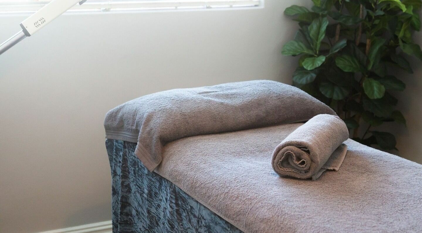 Relaxing massage bed at Gingerlily Spa, Cape Town, Western Cape, ZA, ready for a soothing treatment.