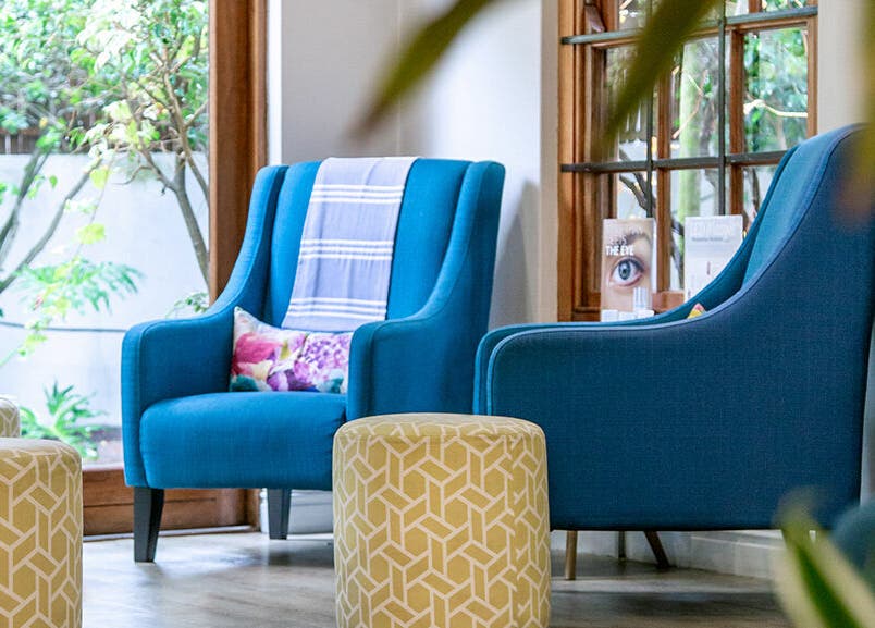 Relaxing blue chairs and green stools at Gingerlily Spa, Cape Town, Western Cape, ZA.