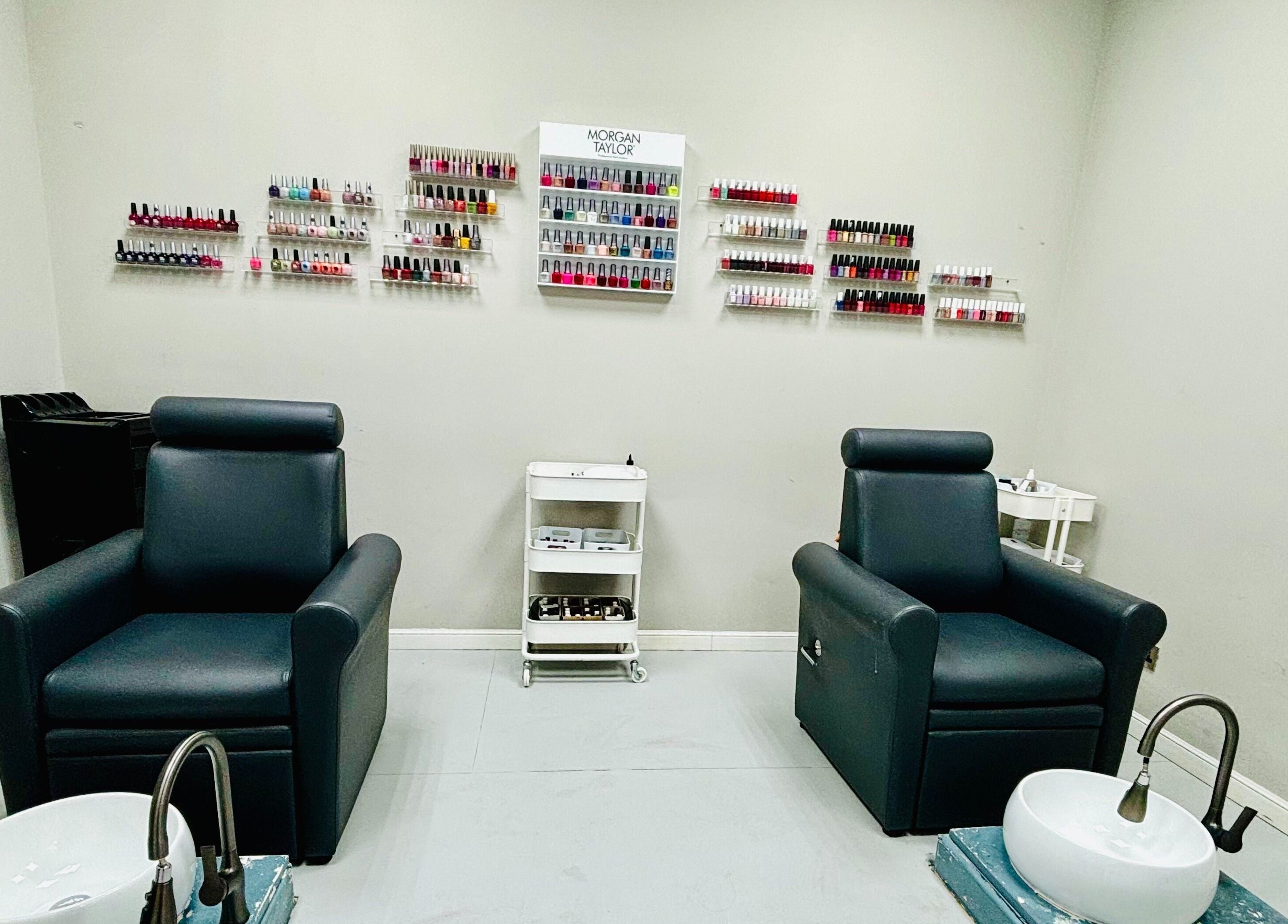 Luxurious manicure chairs at Glitz Beauty Center, Dubai, AE, showcasing nail polish collection.