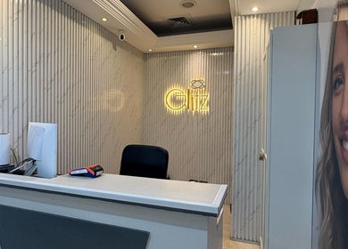 Reception area of Glitz Beauty Center in Dubai, AE, featuring chic decor and a welcoming atmosphere.