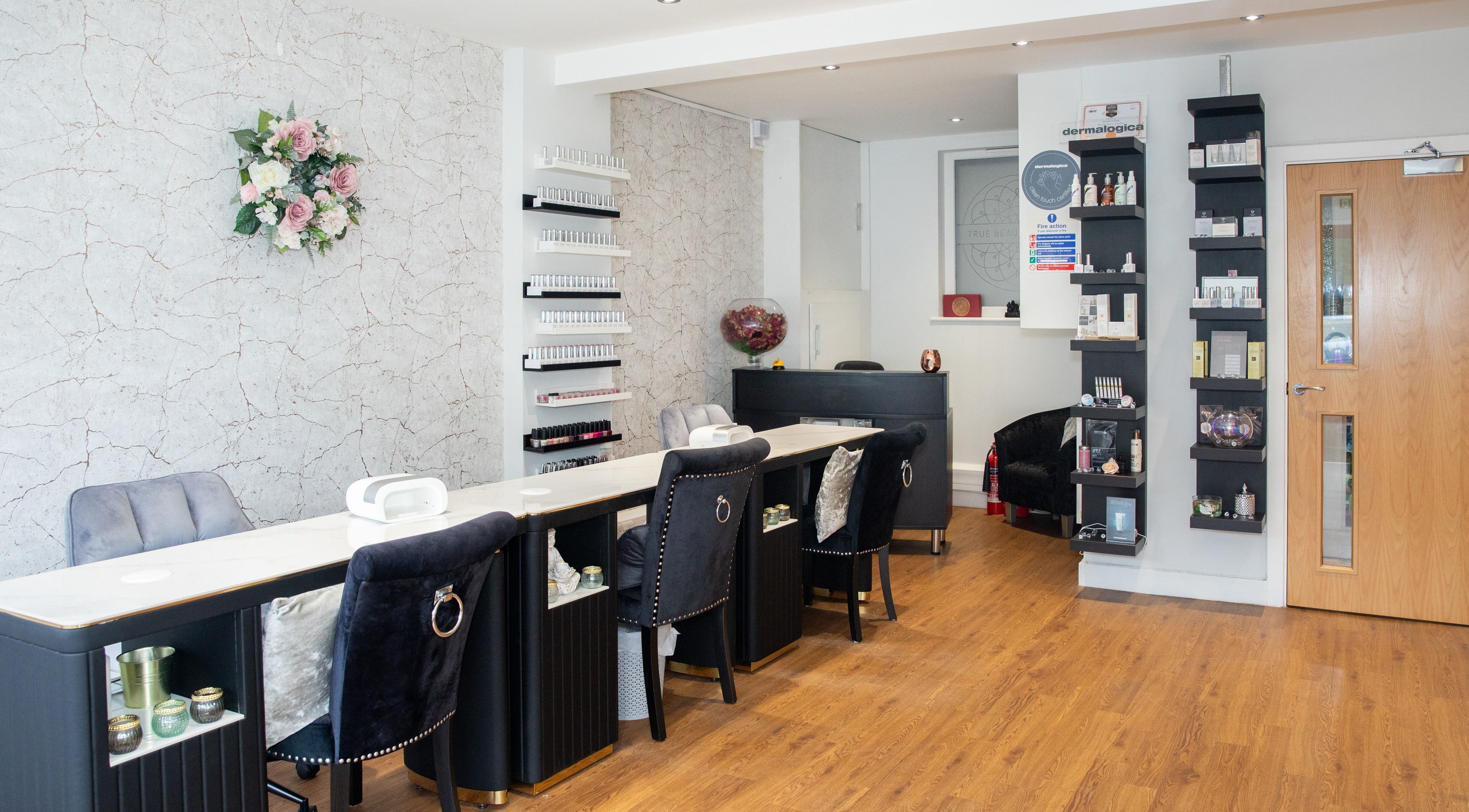 Elegant interior of True Beauty Studio in Brighton, England, GB, featuring stylish seating and beauty products.