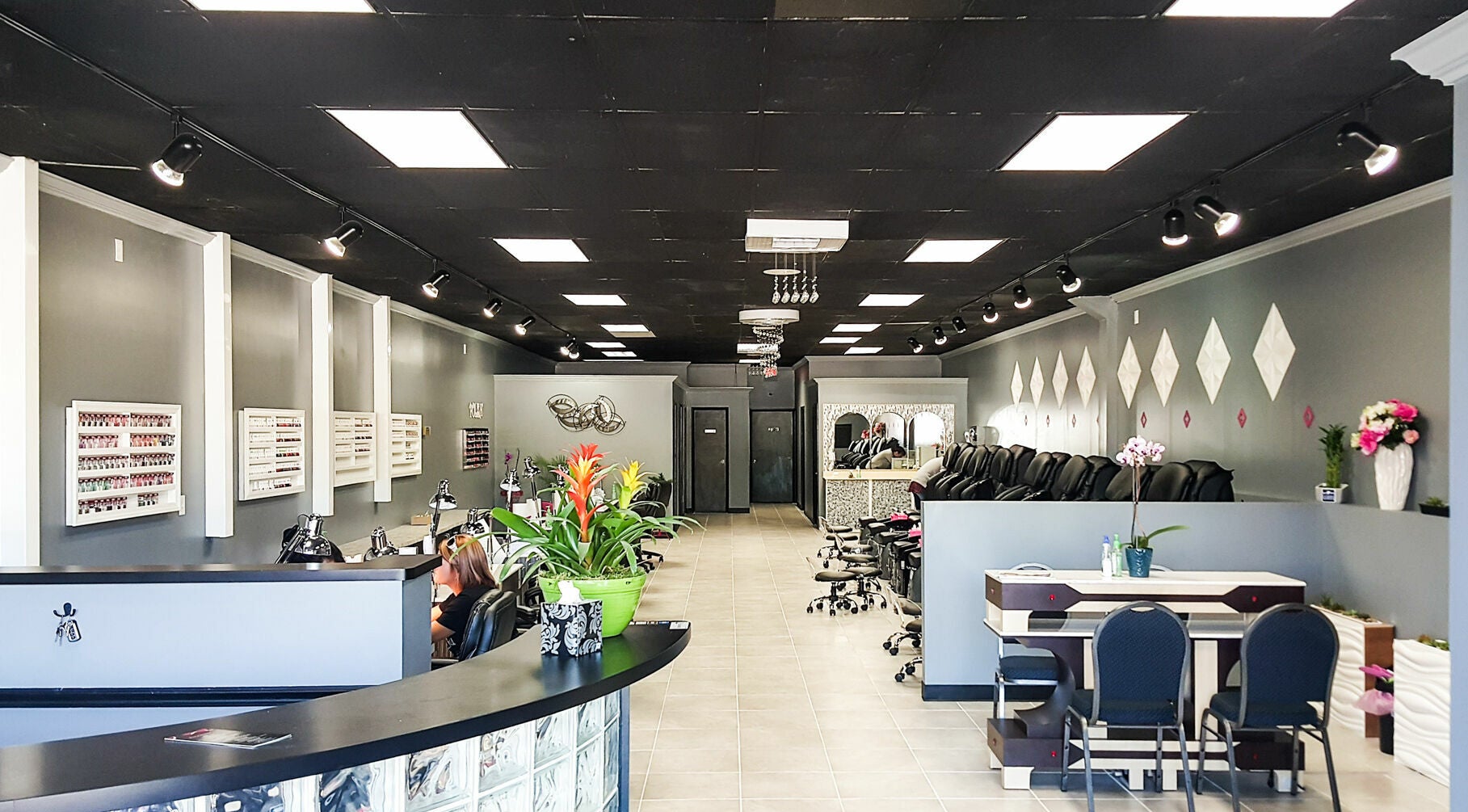 Interior of Golden Honey Nails and Spa in Parma Heights, Ohio, US, featuring sleek nail stations and elegant decor.