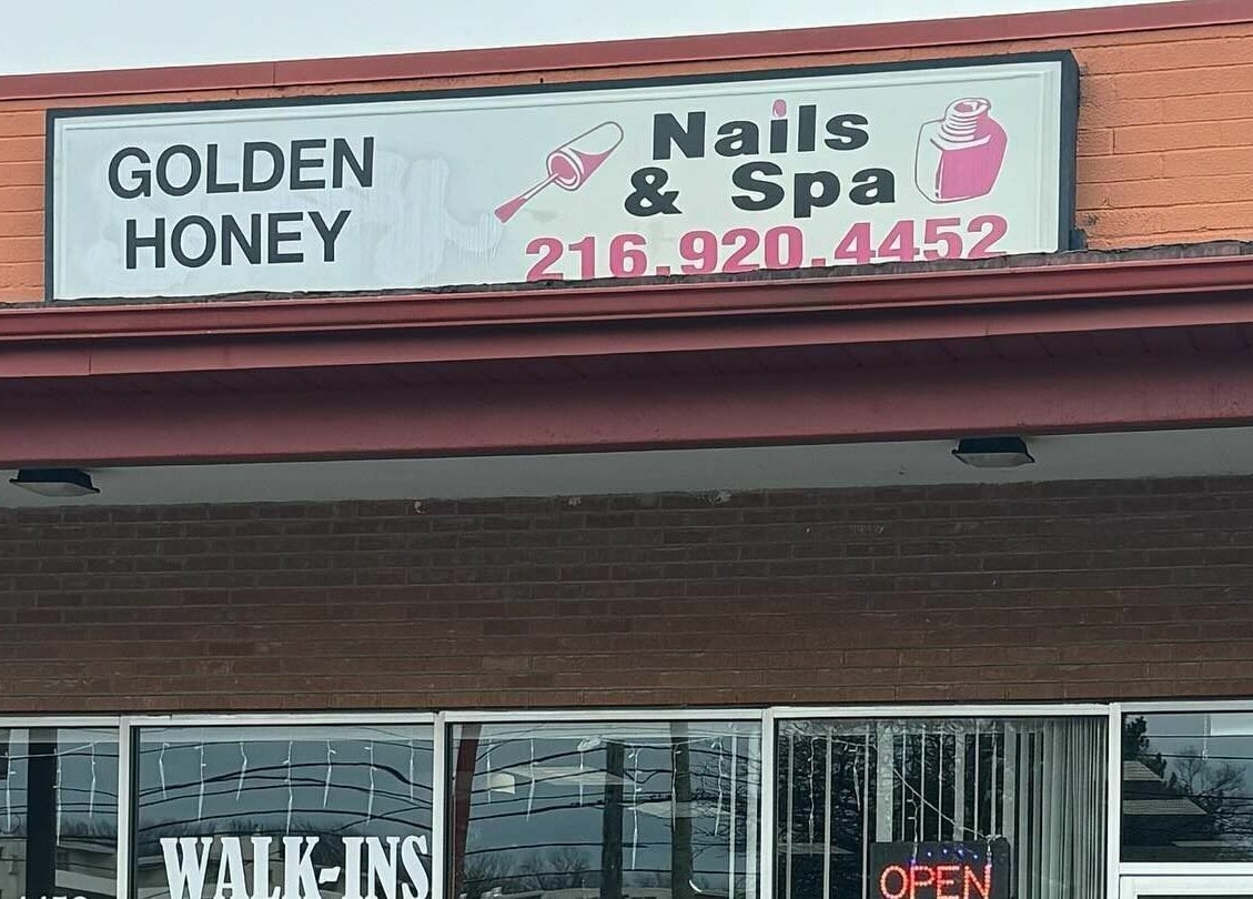 Front signage of Golden Honey Nails and Spa in Parma Heights, Ohio, US, displaying nail services.