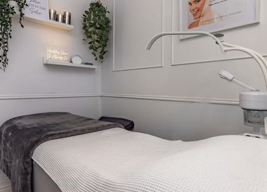 Cozy treatment room at Holly’s Beauty Parlour, Romford, England, GB, featuring a comfortable spa bed.