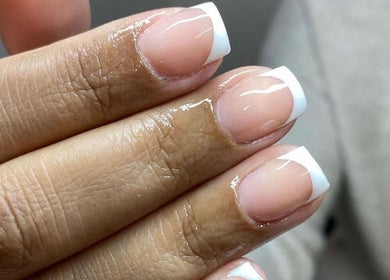 Elegant French manicured nails at Holly’s Beauty Parlour, Romford, England, GB.
