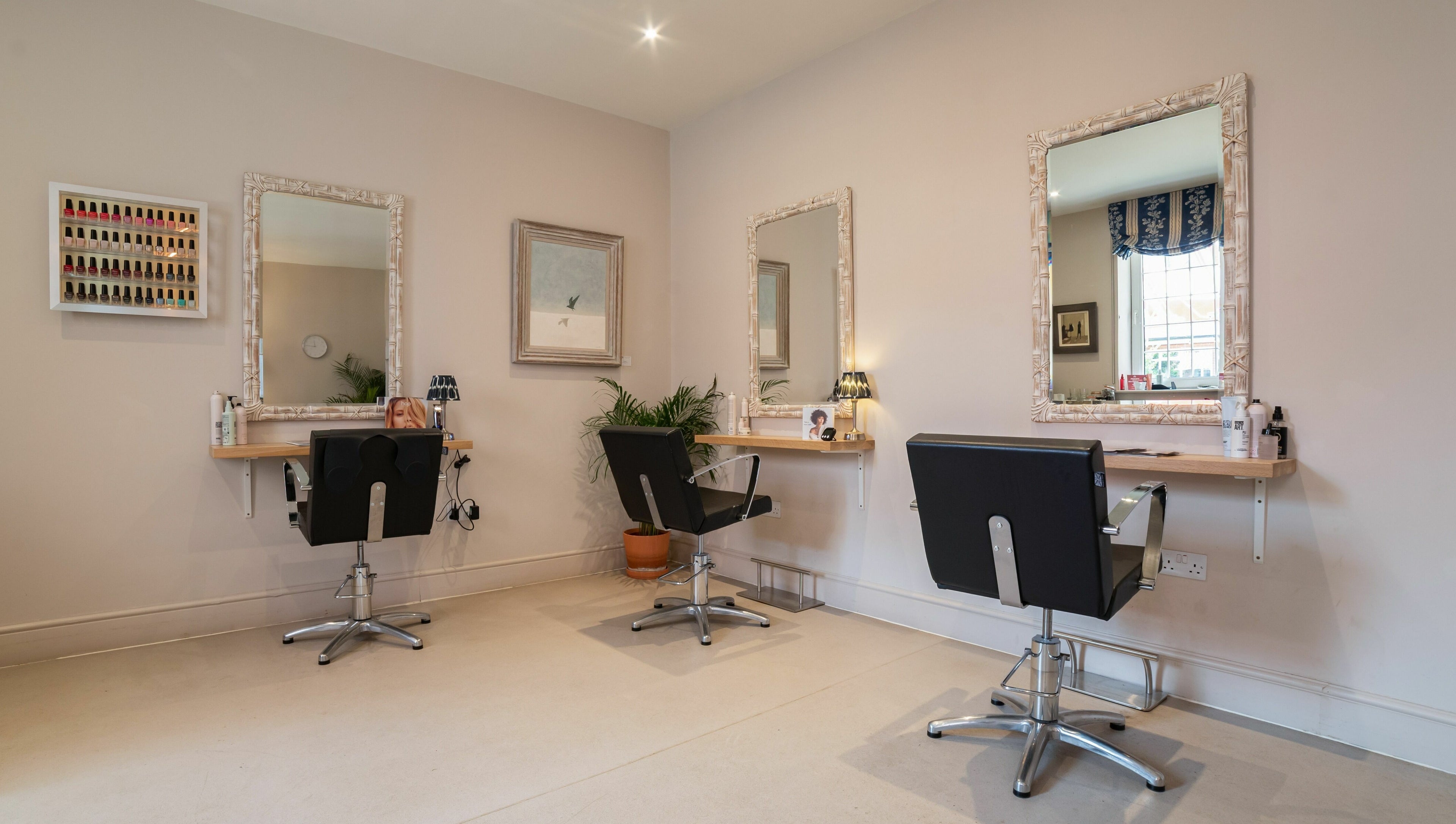 Modern salon chairs and mirrors at Elcot Park Retreat, Newbury, England, GB.