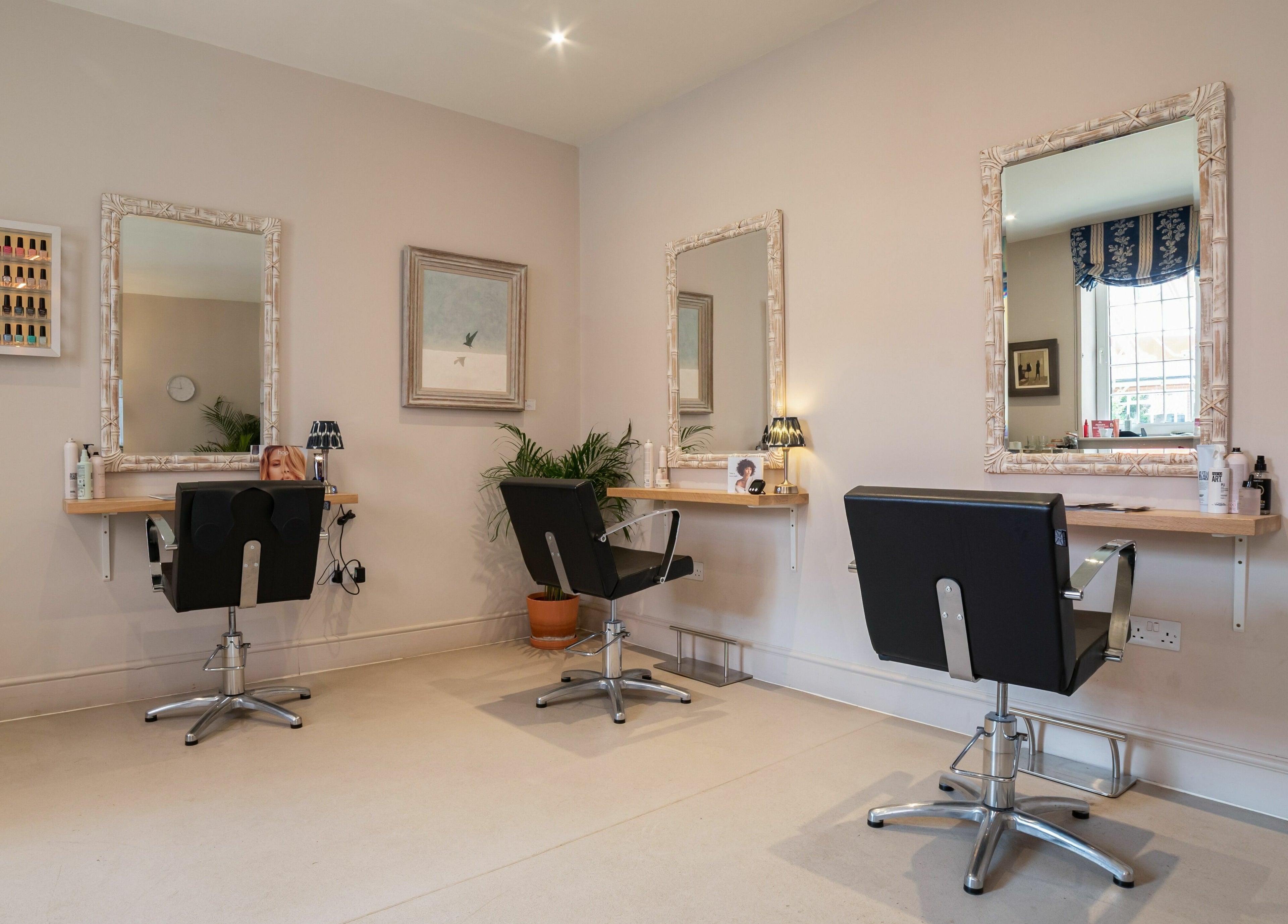 Modern salon chairs and mirrors at Elcot Park Retreat, Newbury, England, GB.