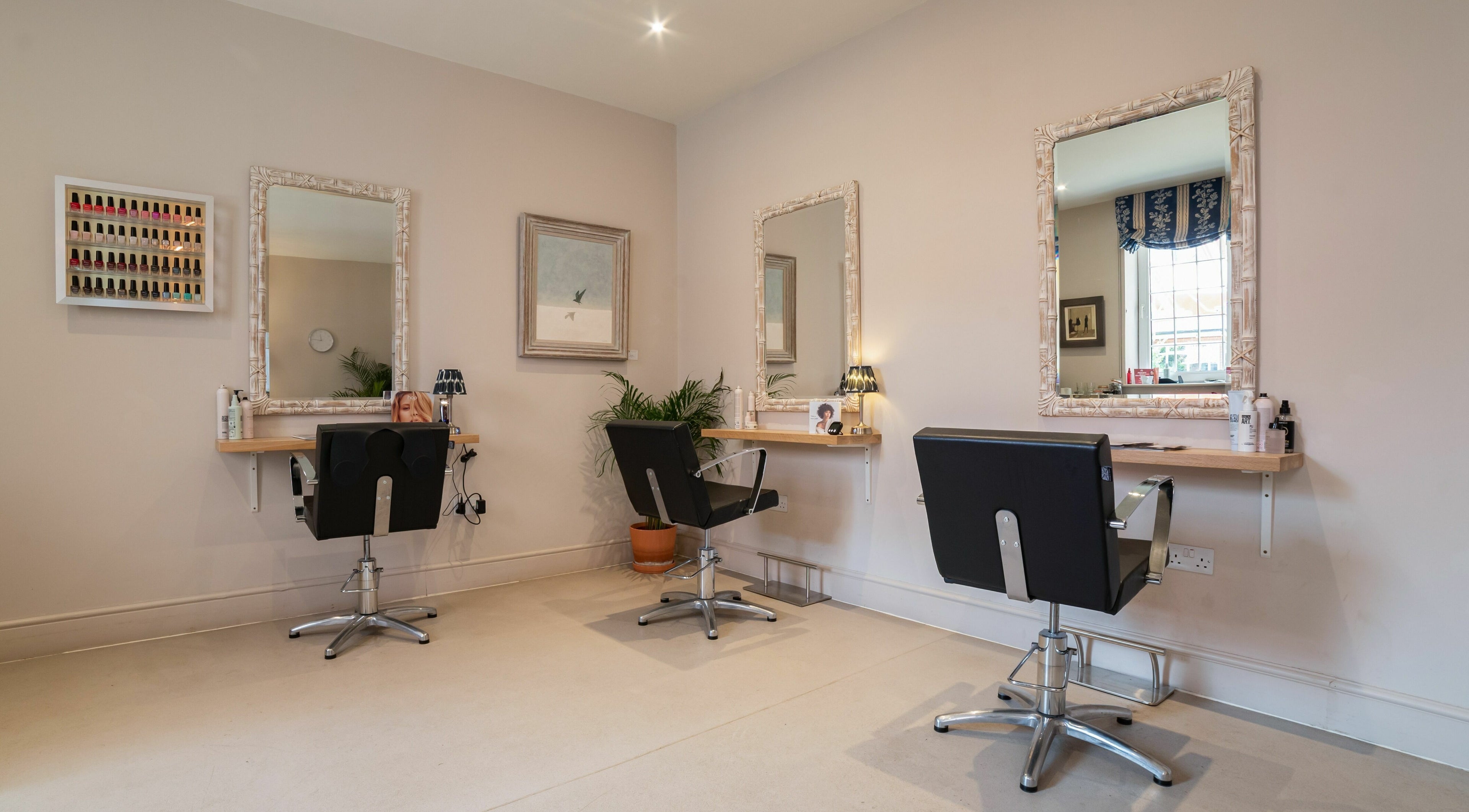 Modern salon chairs and mirrors at Elcot Park Retreat, Newbury, England, GB.