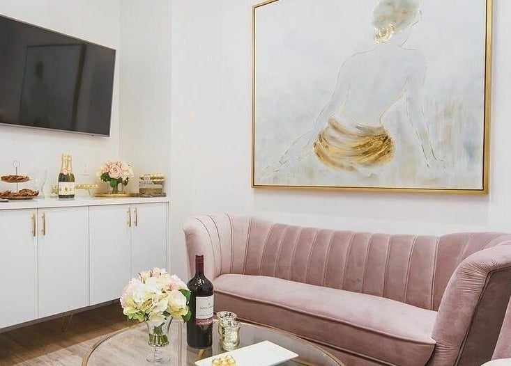 Luxurious lounge at Fusionmed Cosmetic (DT), Toronto, Ontario, CA featuring plush seating and elegant decor.