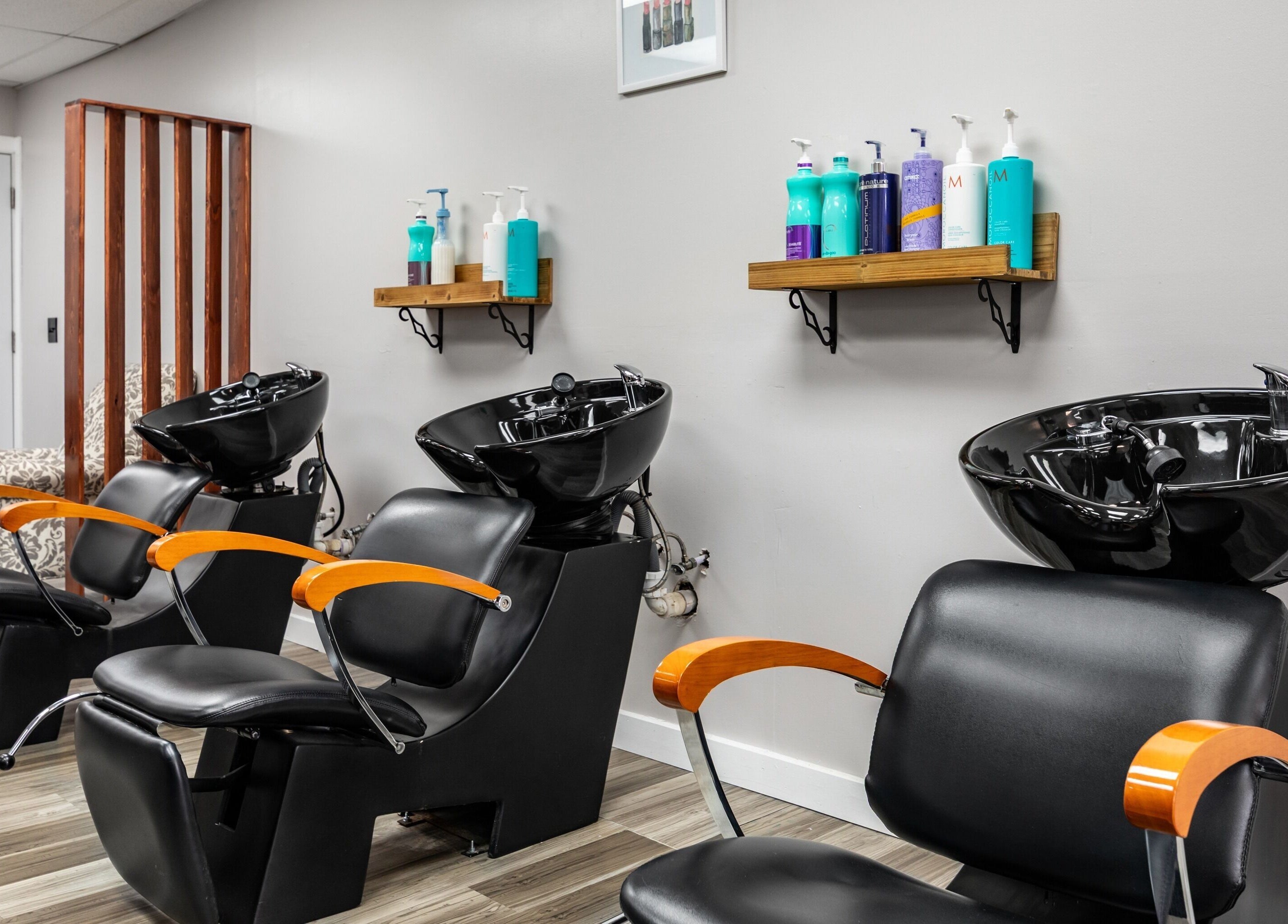 Modern salon chairs and washing stations at EYB Confidence Studio in Elyria, Ohio, US.