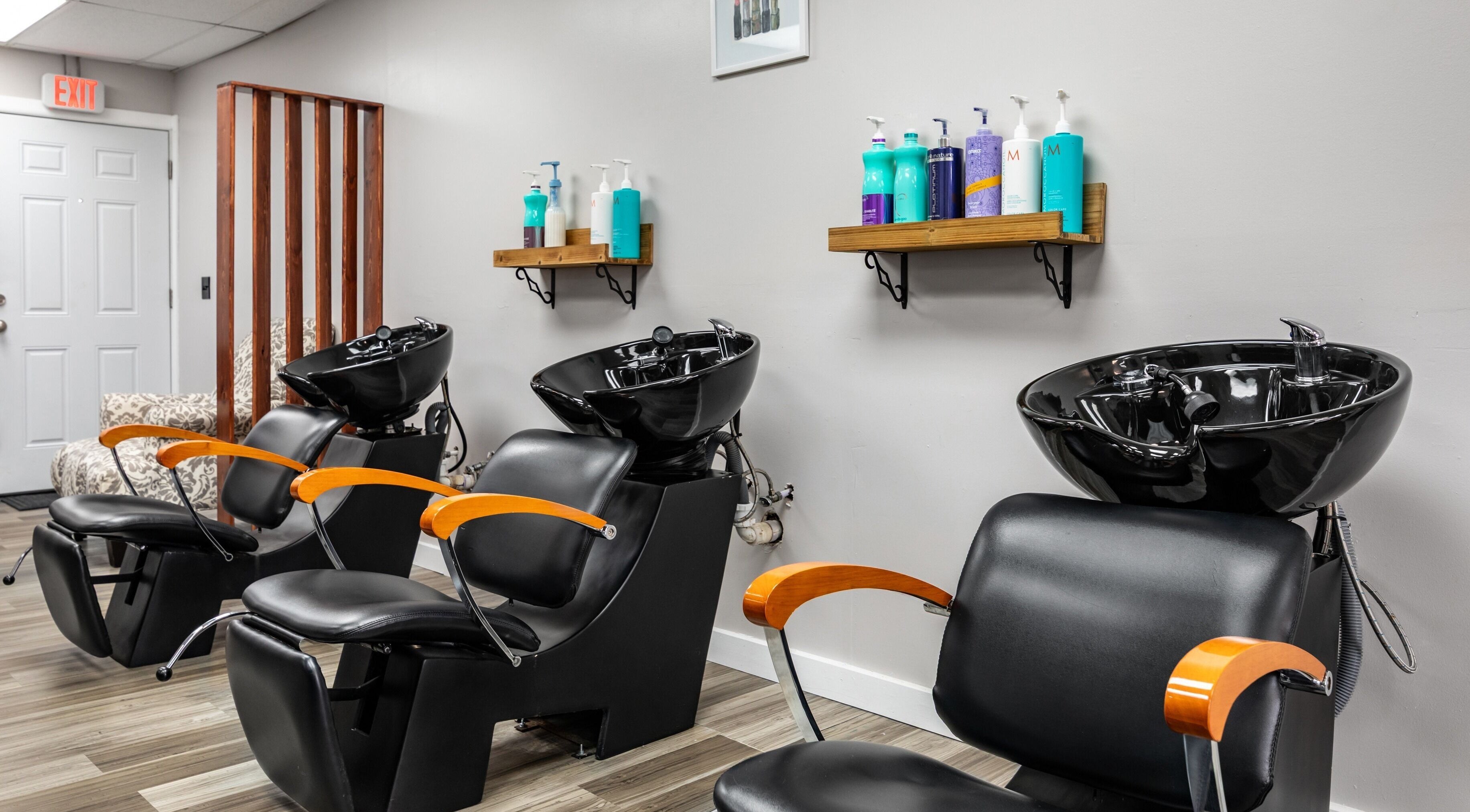 Modern salon chairs and washing stations at EYB Confidence Studio in Elyria, Ohio, US.