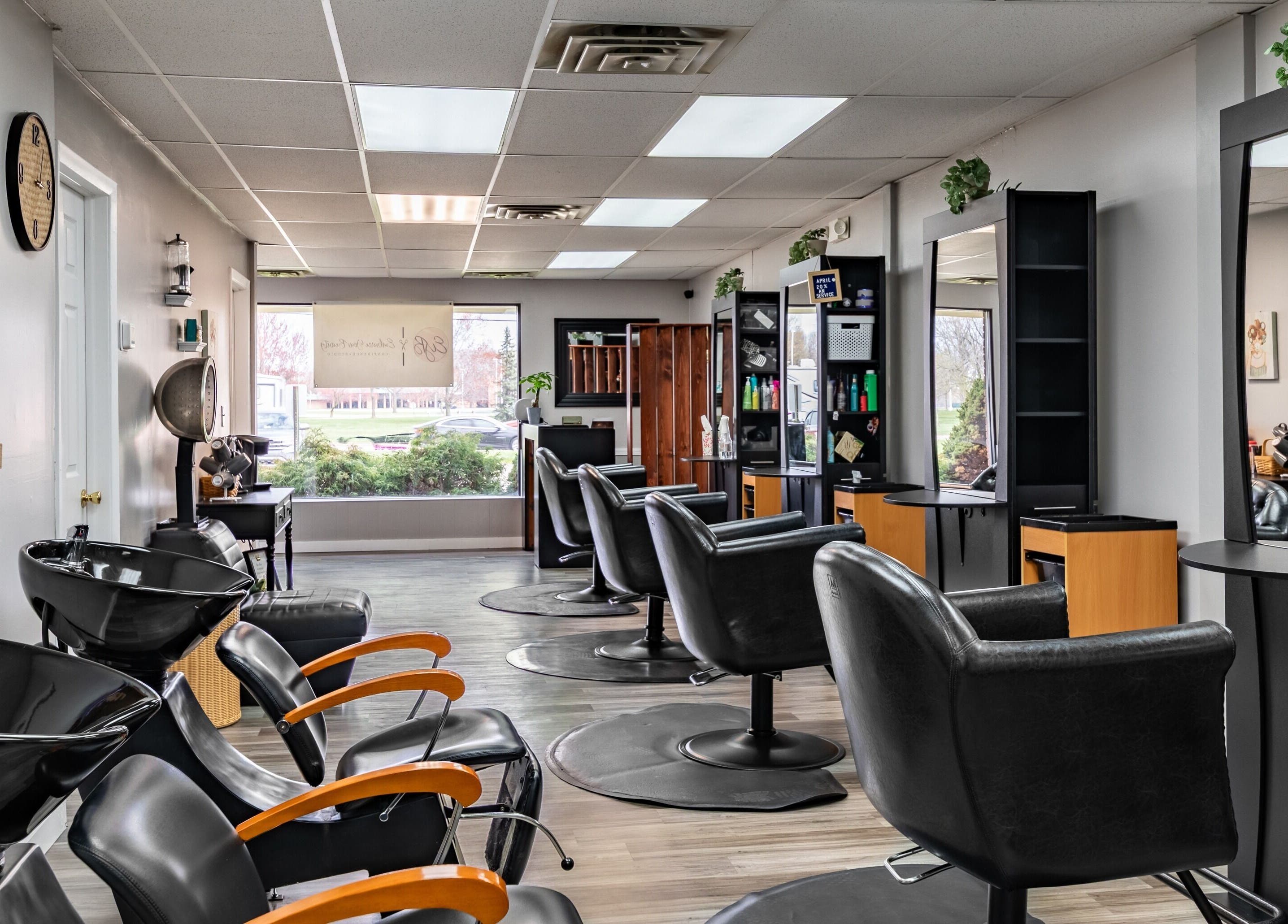 Modern styling chairs at EYB Confidence Studio, Elyria, Ohio, US offer a chic and comfortable beauty experience.