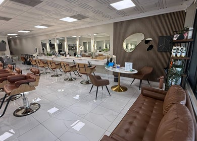 Modern interior of Fios Beauty salon, Miami, Florida, US, featuring stylish chairs and elegant decor.