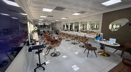 Spacious salon interior at Fios Beauty in Miami, Florida, US with stylish chairs and mirrors.