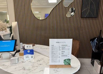 Fios Beauty reception area with menu display in Miami, Florida, US showcasing services.
